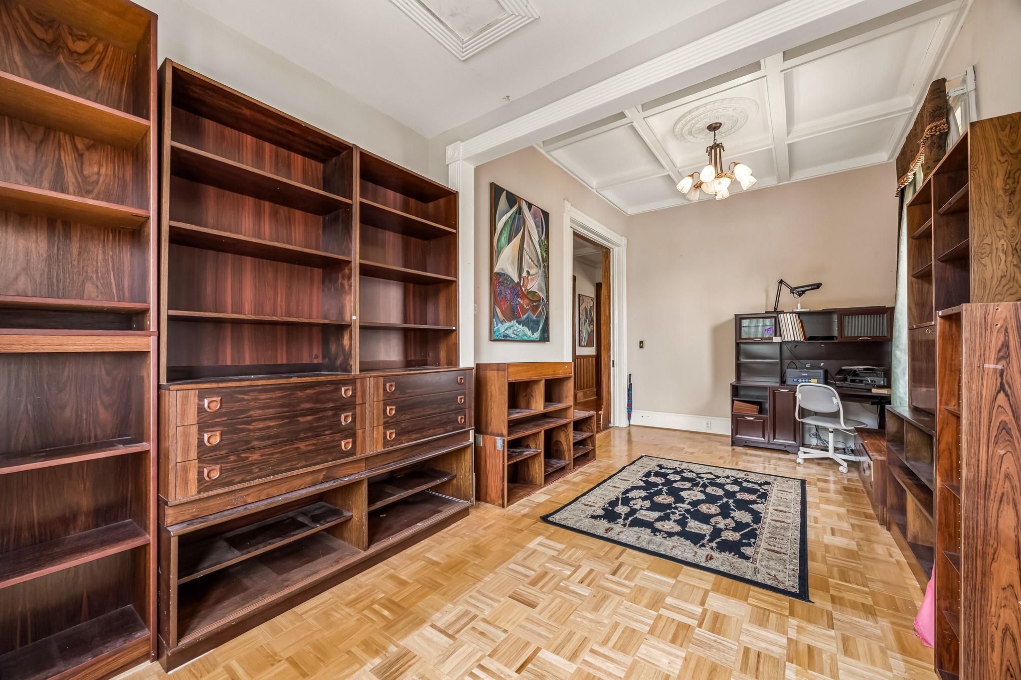 A large home office space is located to the right of the entrance. Note the tray ceiling detail.