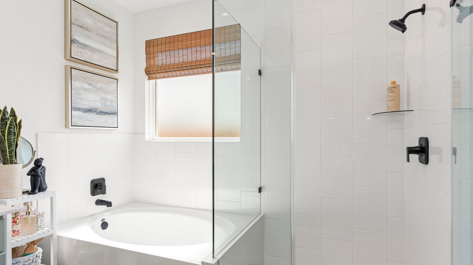 glass enclosed shower in the primary bedroom