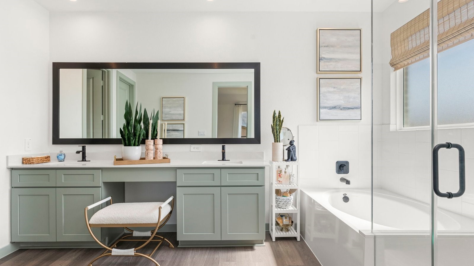 a spacious primary bedroom with a separate shower and tub and dual sinks