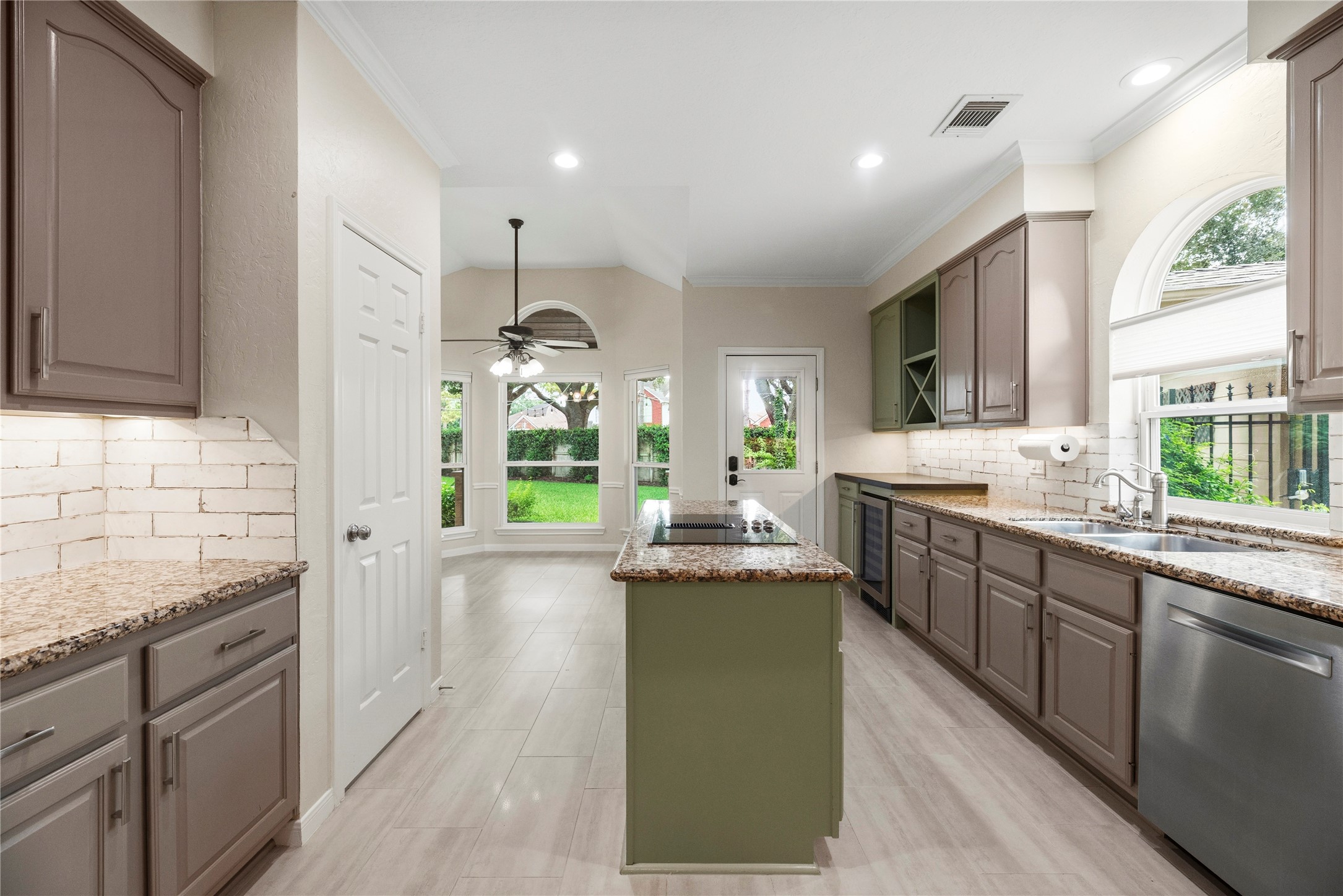 Spacious kitchen featuring granite countertops, abundant cabinetry, and modern appliances.