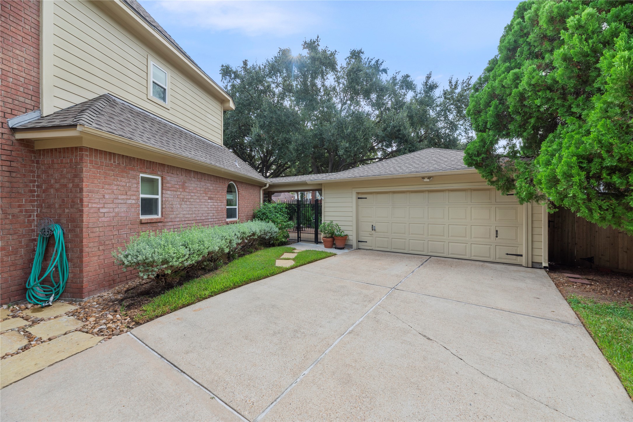 Long and spacious driveway leads to an oversized two-car detached garage.