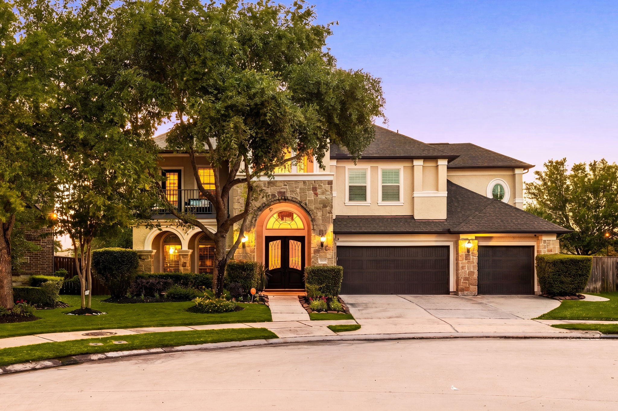 Stunning curb appeal at 5102 Hawthorne Bend Drive in Cinco Ranch Southwest! Stone & stucco elevation, grand arched entryway, gorgeous double doors with glass detailing, 3-car garage, and beautiful mature trees, all on a quiet cul-de-sac. Stunning curb appeal at 5102 Hawthorne Bend Drive in Cinco Ranch Southwest! Stone & stucco elevation, grand arched entryway, gorgeous double doors with glass detailing, 3-car garage, and beautiful mature trees, all on a quiet cul-de-sac.