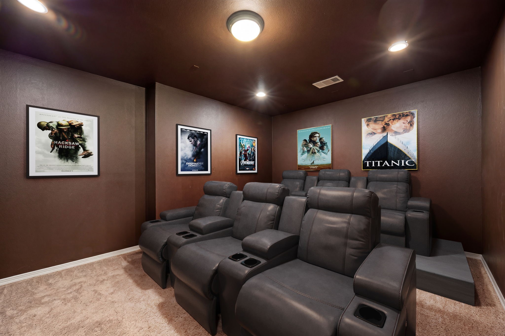 Lights, camera, action! Your very own private theatre at home! This dedicated media room features tiered stadium seating, plush carpet, recessed lighting, and dramatic dark walls, the ultimate movie night experience without ever leaving the house! *Virtually Staged