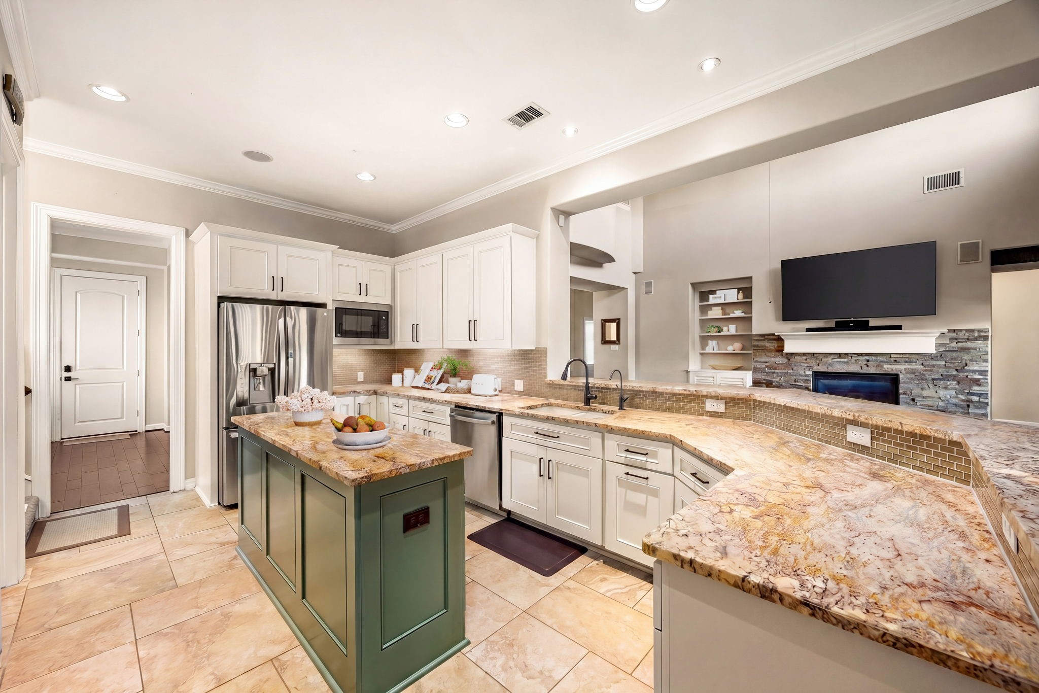 Function meets style! Stainless steel appliances, white shaker cabinets, a statement granite island, and a seamless open view into the family room, this kitchen truly is the heart of the home. *Virtually Staged