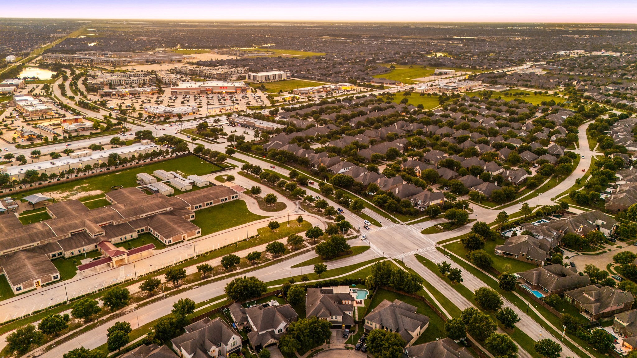 Everything you need, right around the corner! This sweeping aerial view highlights the incredible convenience of Cinco Ranch Southwest, top-rated schools, shopping, dining, and major thoroughfares all just minutes away.