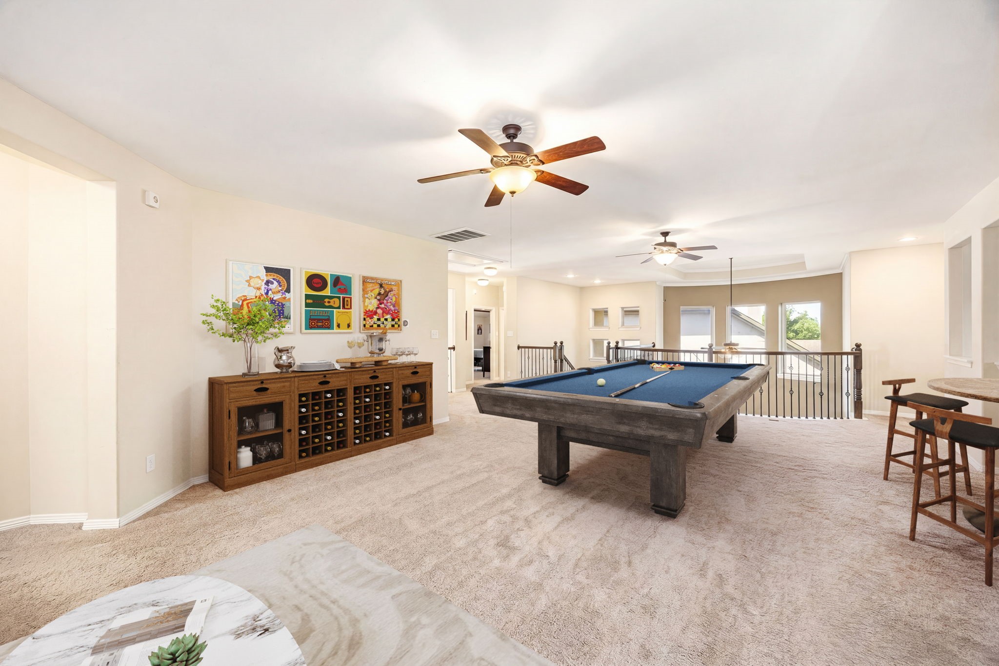 This massive upstairs game room offers endless space with plush carpet, dual ceiling fans, and plenty of room to make it your own. *Virtually Staged