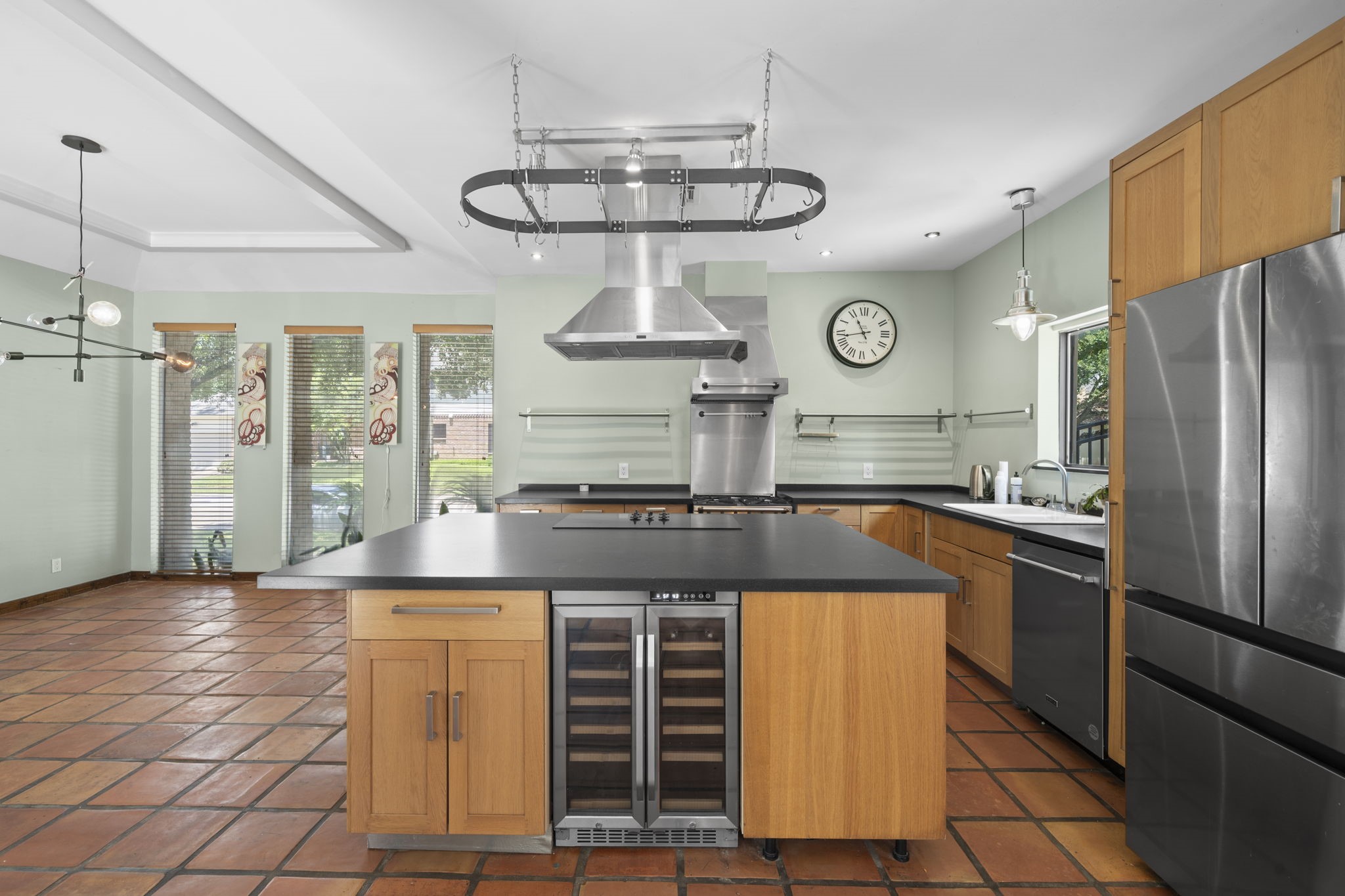The wine and beverage fridge adds a polished convenience feature within the kitchen. It supports the homes entertaining layout and keeps the main kitchen highly functional.