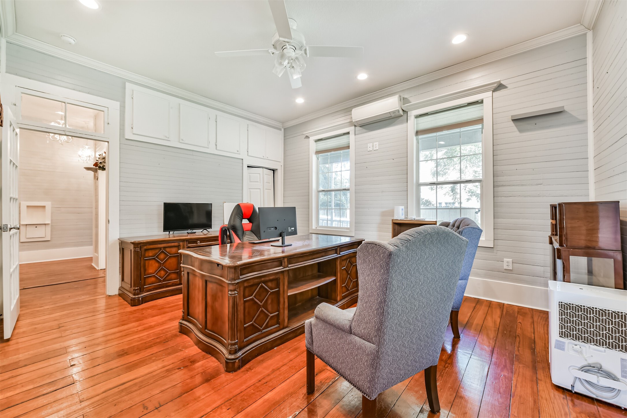 Flexible main-level room currently configured as an office with beautiful original hardwood floors.