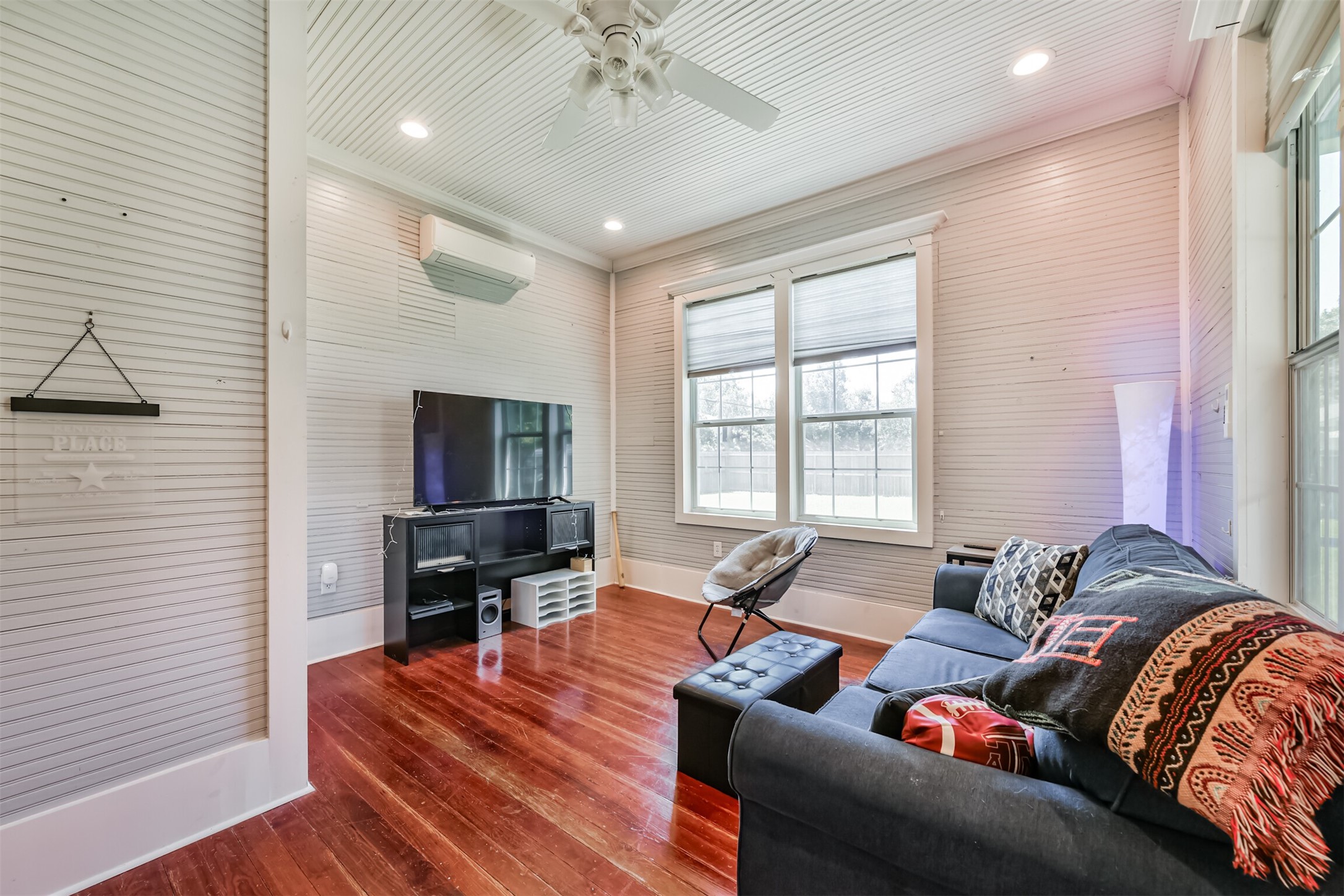 Versatile main-level room offers flexibility as a bedroom, private office or separate living space.