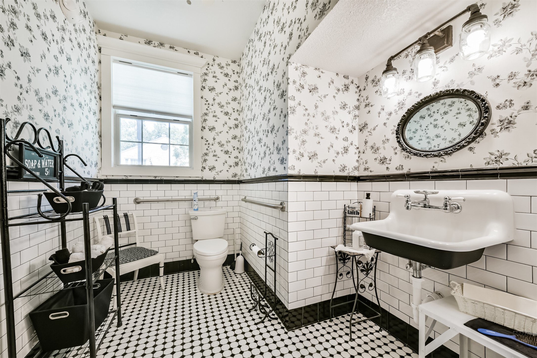 Updated main-level half bath with charming vintage-inspired finishes.