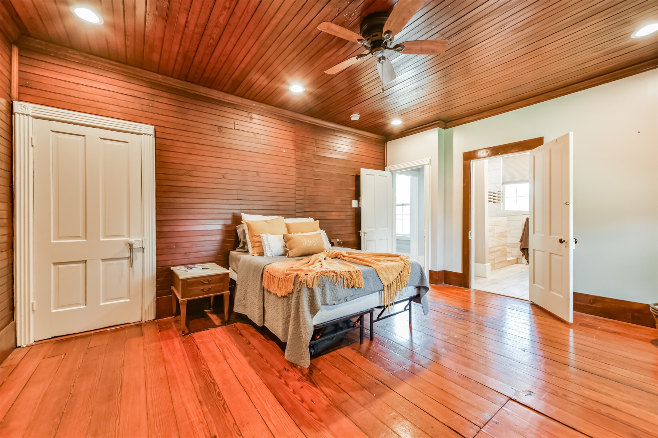 Spacious upstairs bedroom offers beautiful woodwork, hardwood flooring and plenty of room to unwind.