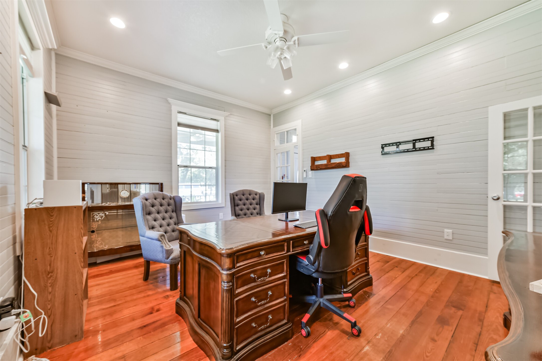 Spacious first-floor office easily adapts to a bedroom, workspace or additional living area.