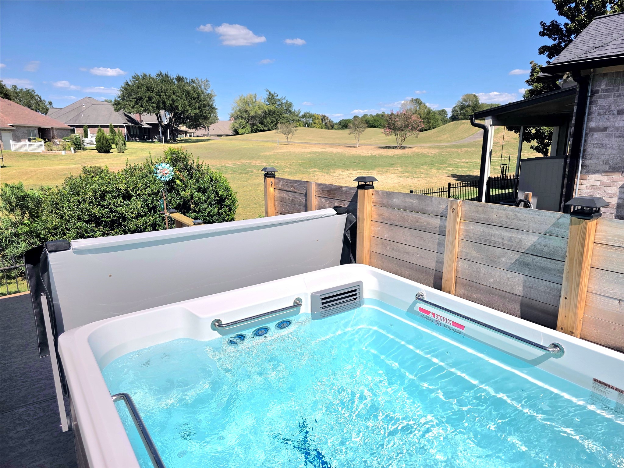 Have your tee time and then enjoy your cool down time in this very private and wonderful swim spa with this great view!