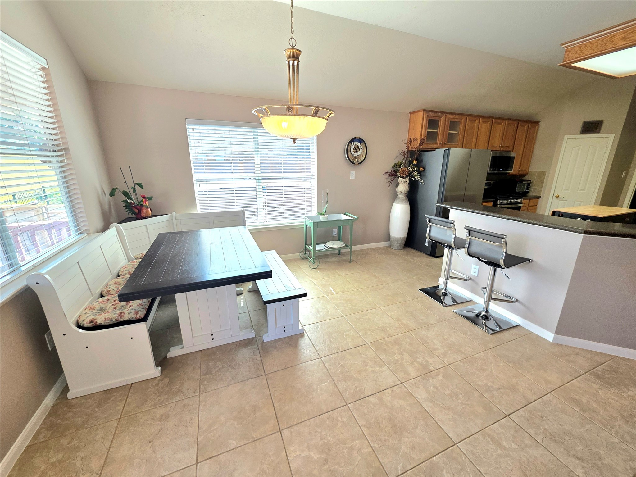 Large breakfast area open to the living area and kitchen with great views outside