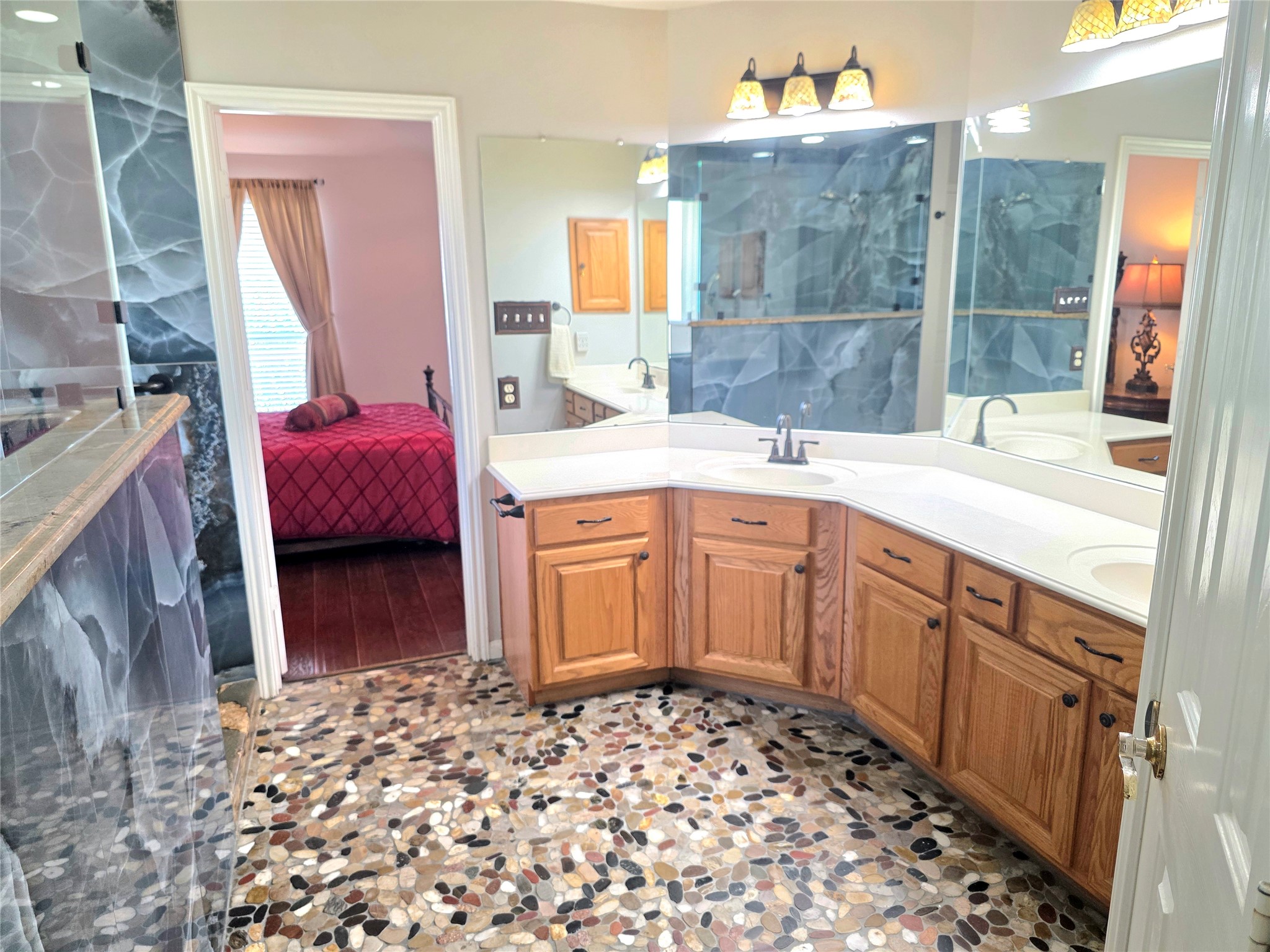 Double vanity and lots of cabinets in this roomy primary en-suite