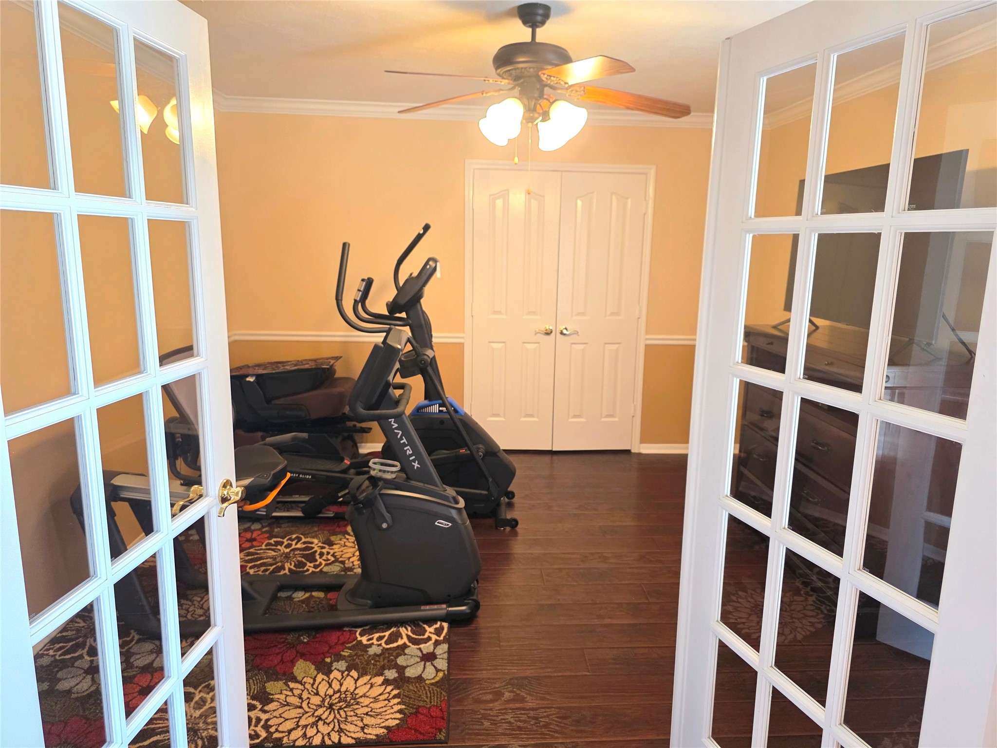 Spacious study just off the entryway to the right with gorgeous French doors for privacy