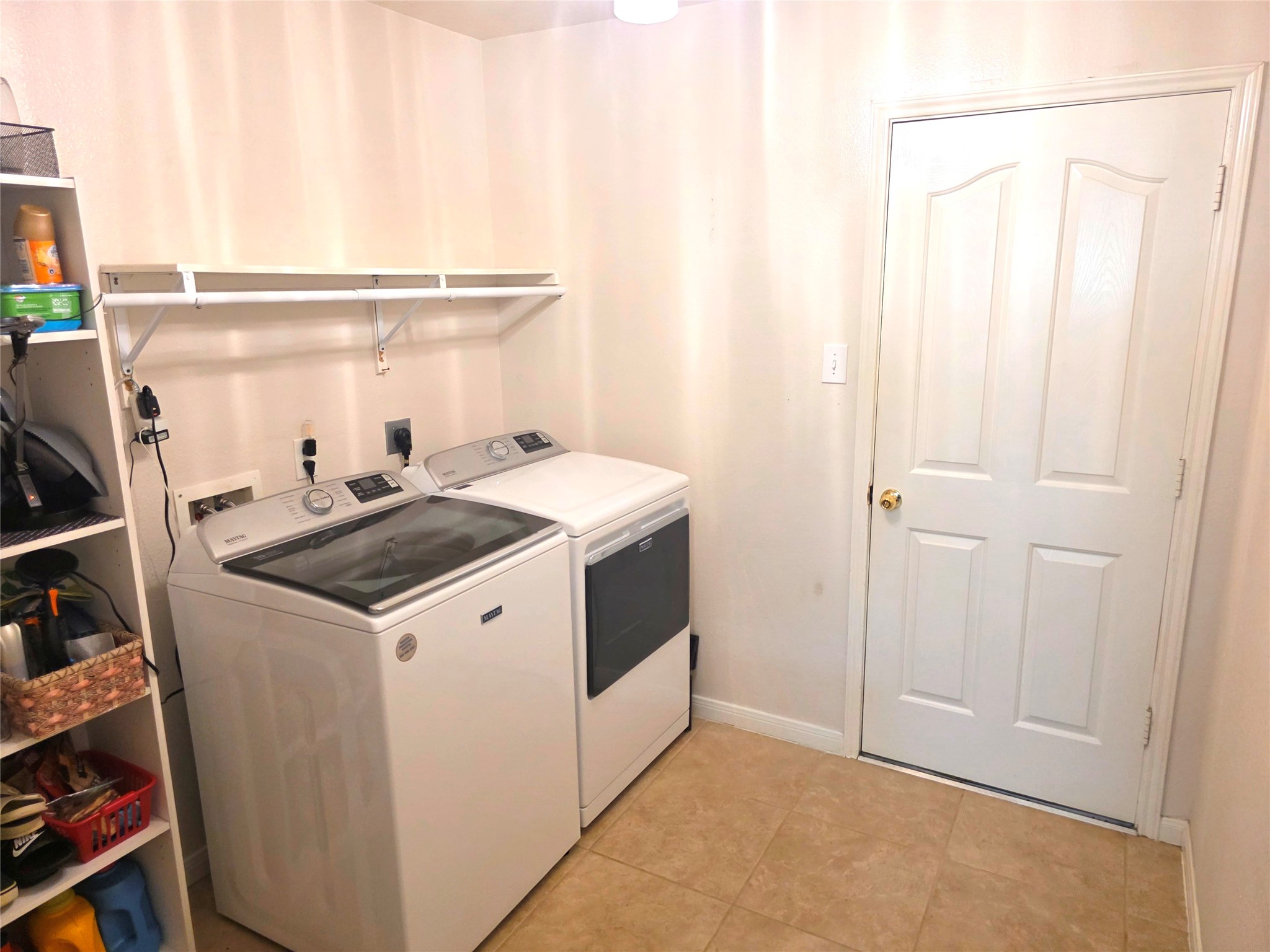 Nice sized laundry room off the kitchen with a door out to the garage.