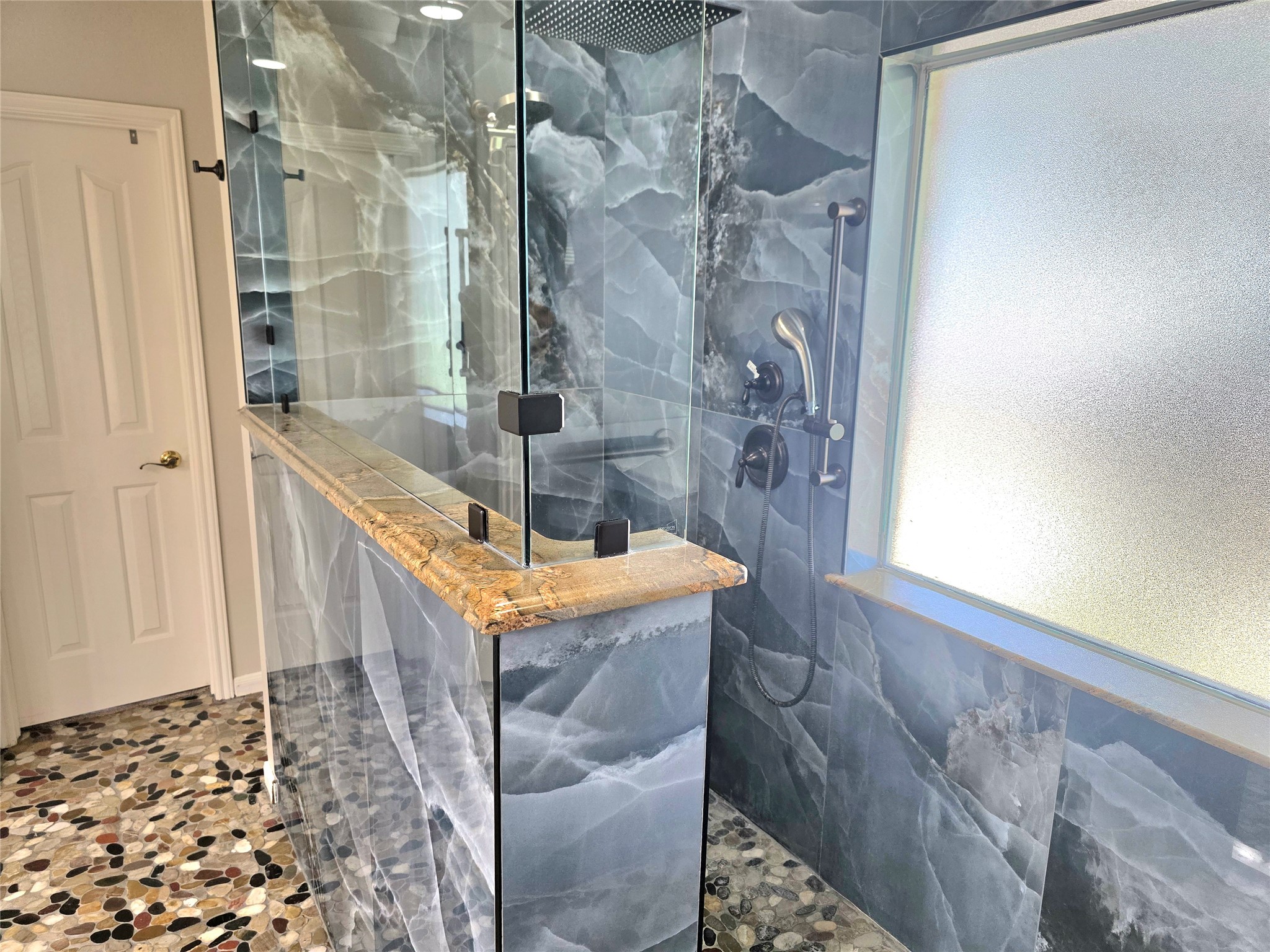 Enjoy this gorgeous  walk in shower that is wheel chair accessible