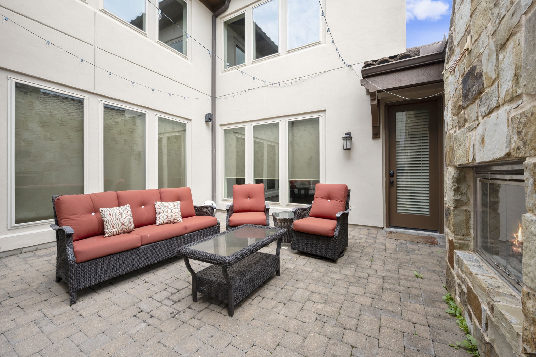 One of two outdoor sitting areas. This one features a fireplace.