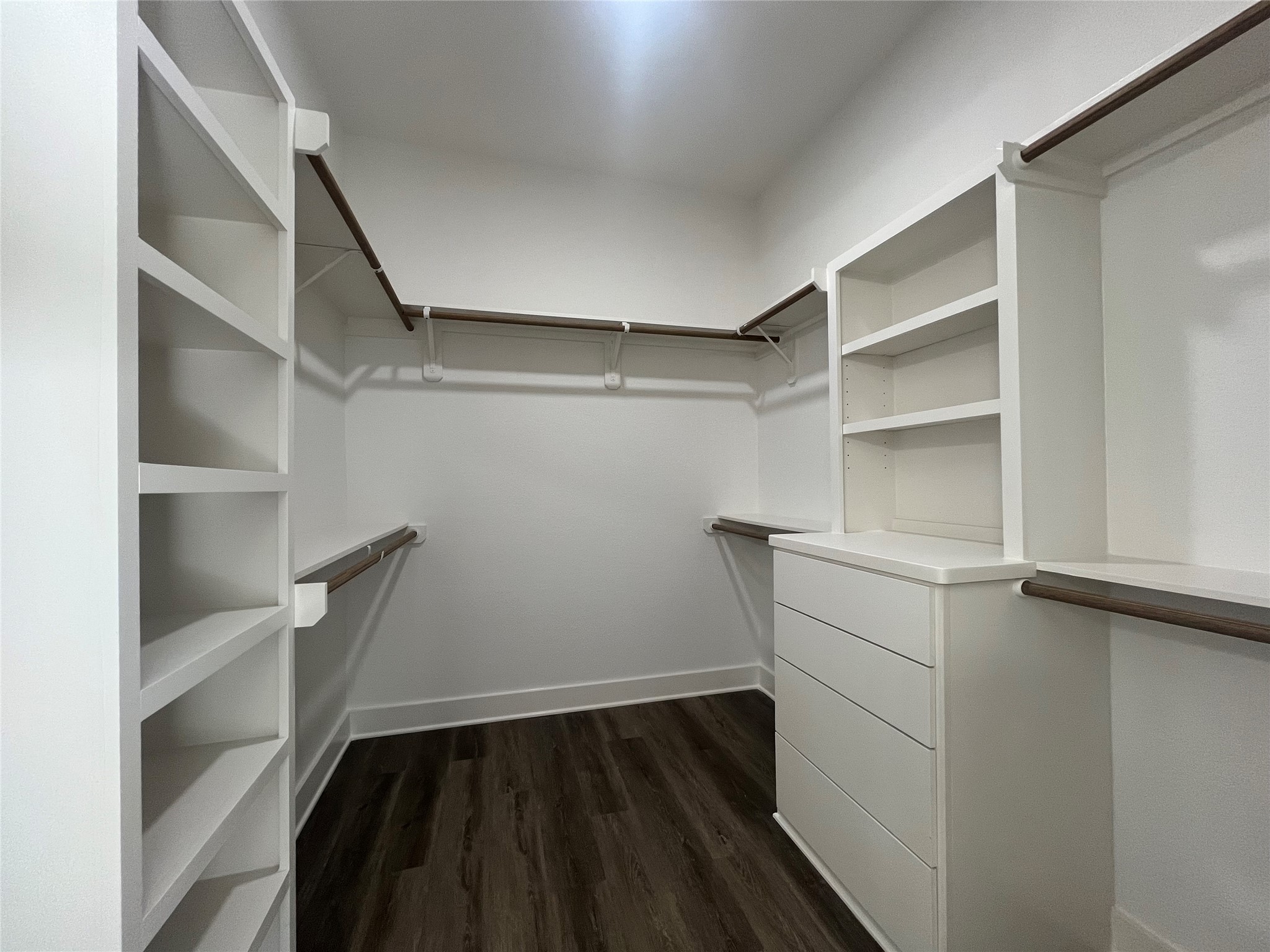 28807 Champion Oak primary walk-in closet with built in shelves and drawers