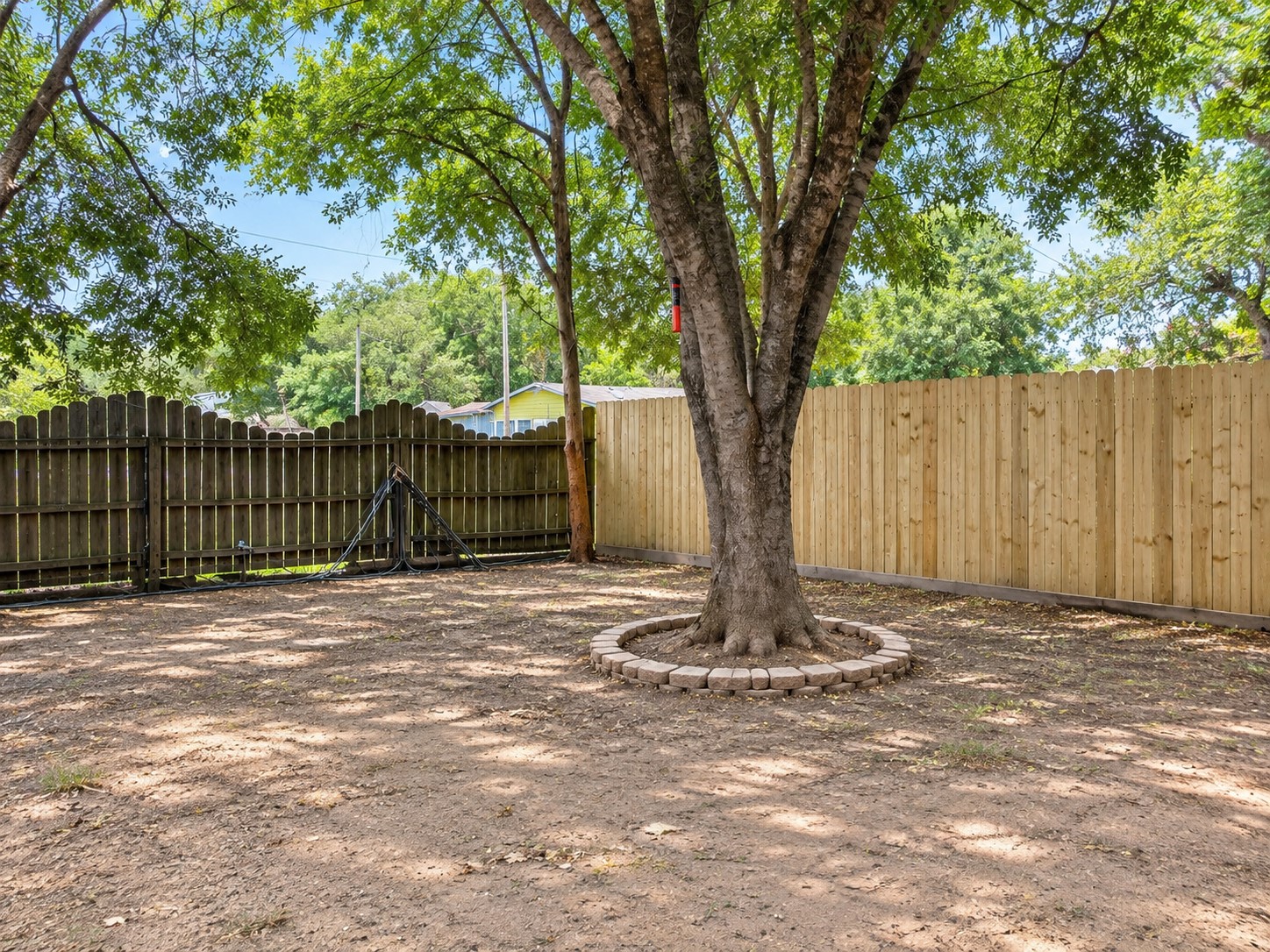 another view of fully fenced in backyard.