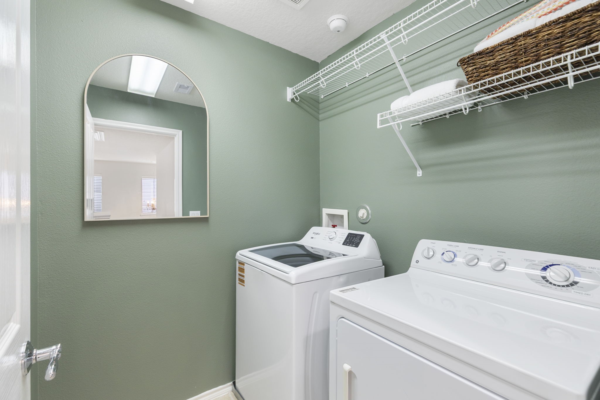 The laundry room is ideally located upstairs and has been freshly painted. This is a wonderfully sized laundry with abundant storage. The washer and dryer are included.