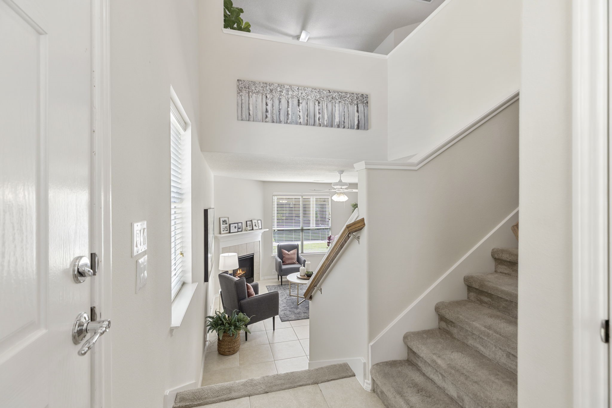 Your guests and family will be pleasantly greeted in the foyer with a soaring ceiling and views of the open living area. Welcome home!