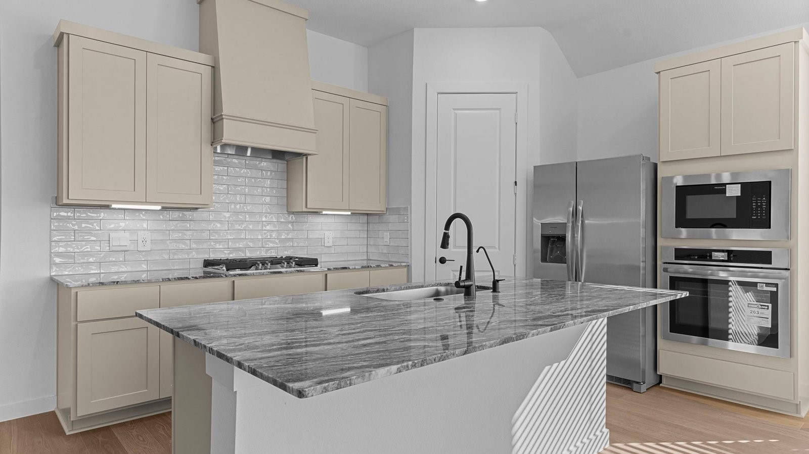 Kitchen adorned with painted cabinets seamlessly integrated into an open dining area layout.