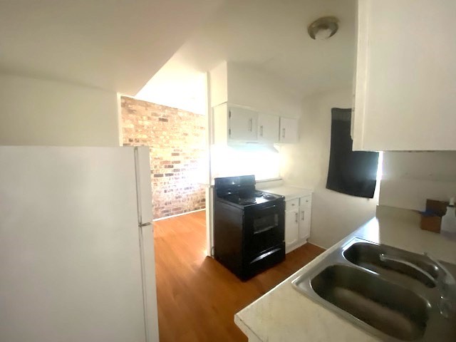 Kitchen with refrigerator included.