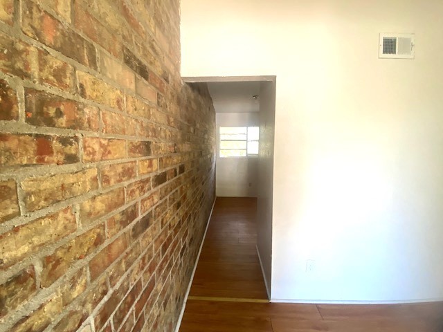 The accent brick wall extends out to into the breakfast room.