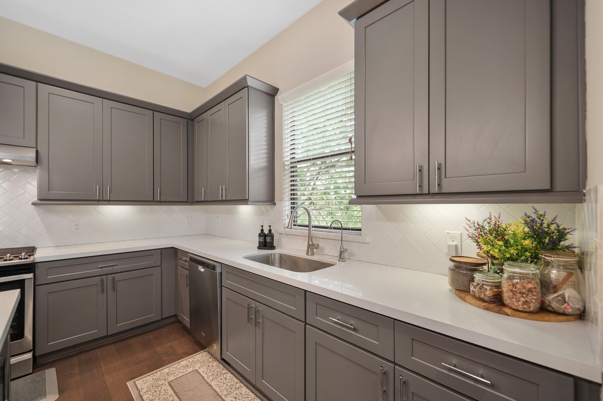 Thoughtfully planned, this beautiful kitchen includes plenty of counter & storage space along with soft close cabinets, drawers and a pantry.