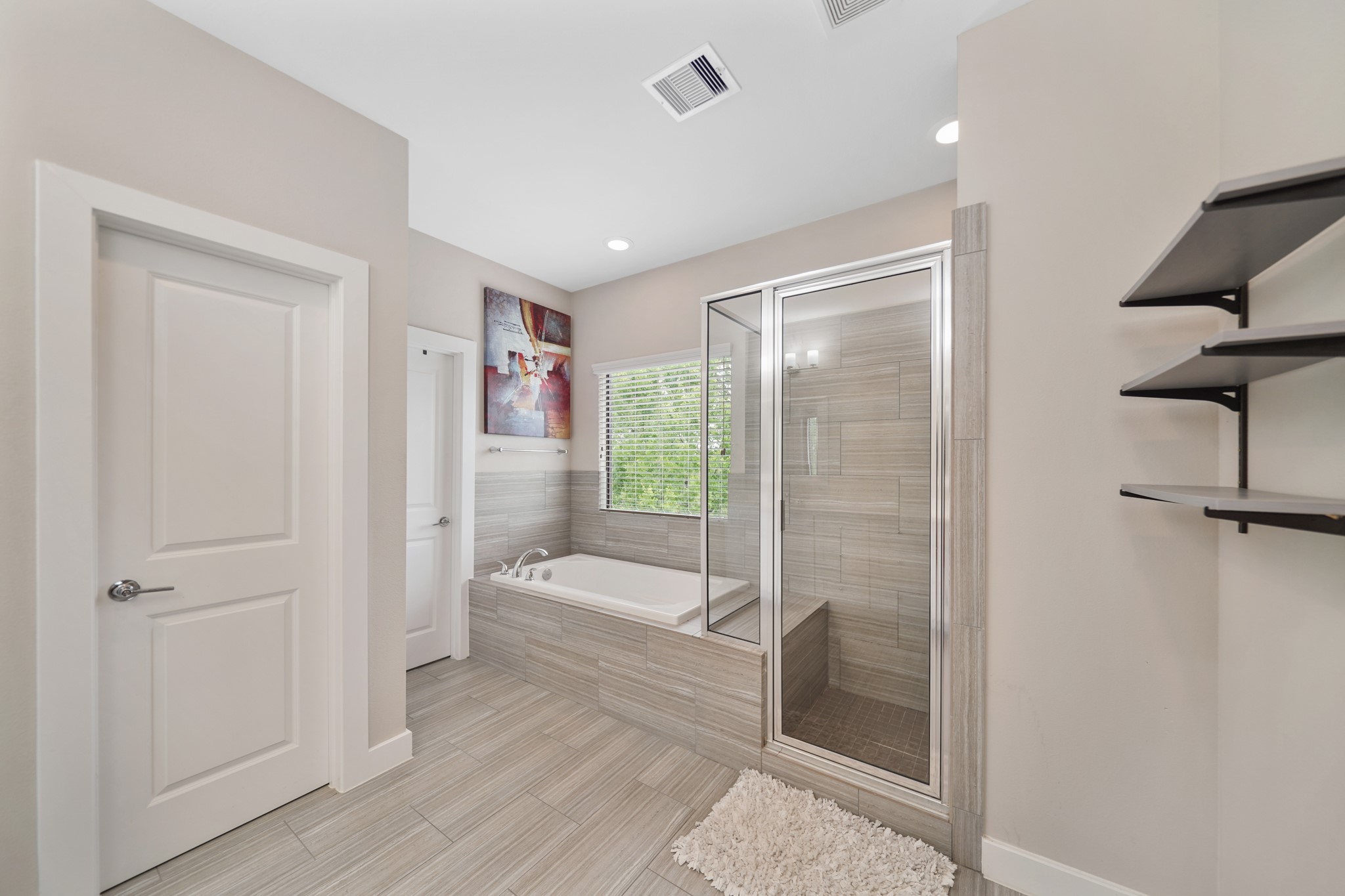Additional features include a private water closet, a second walk-in wardrobe storage closet & tile flooring.