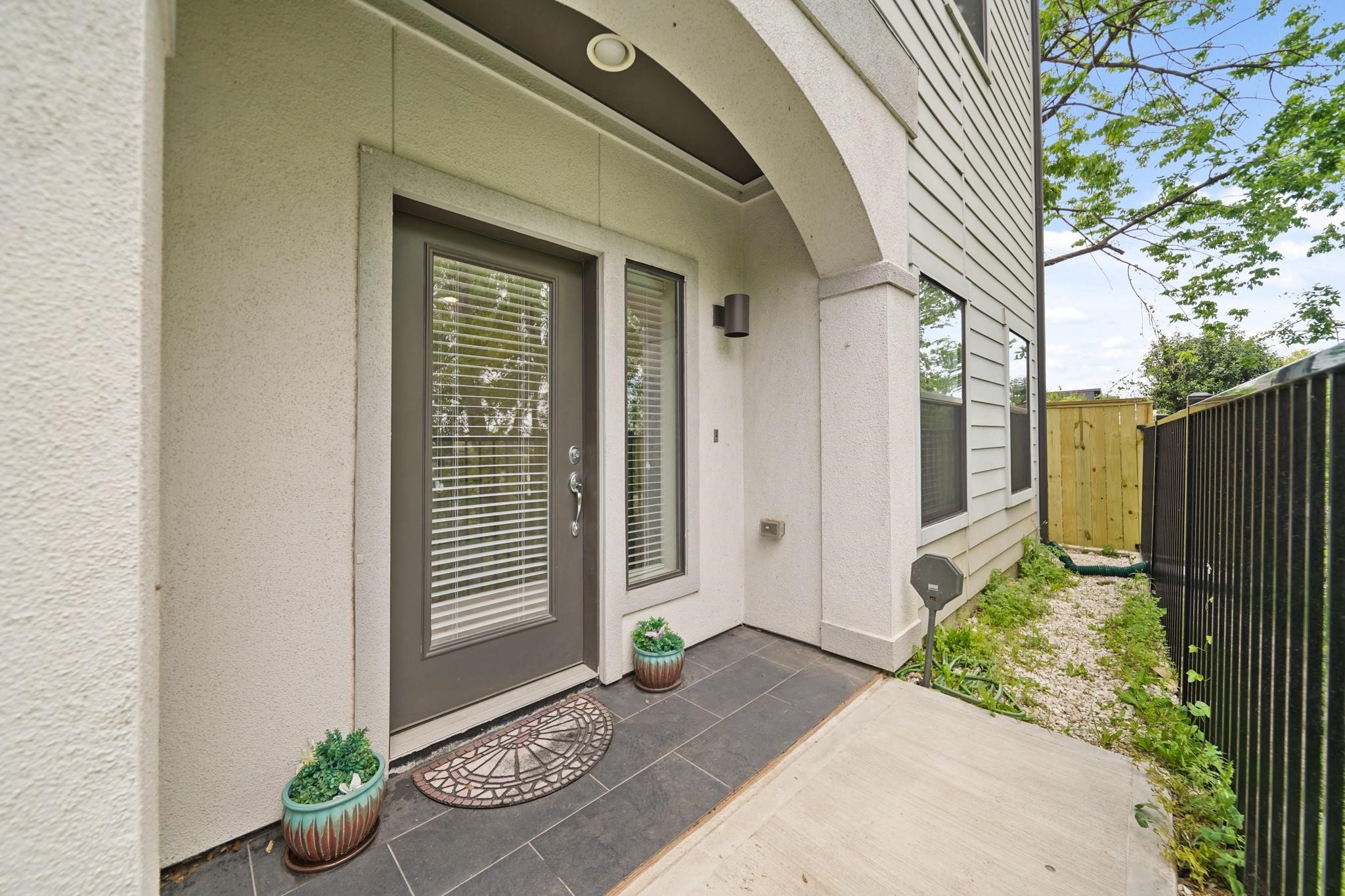 Welcome family & friends to your new home on this covered front porch with recessed lighting & tile flooring. Welcome family & friends to your new home on this covered front porch with recessed lighting & tile flooring.