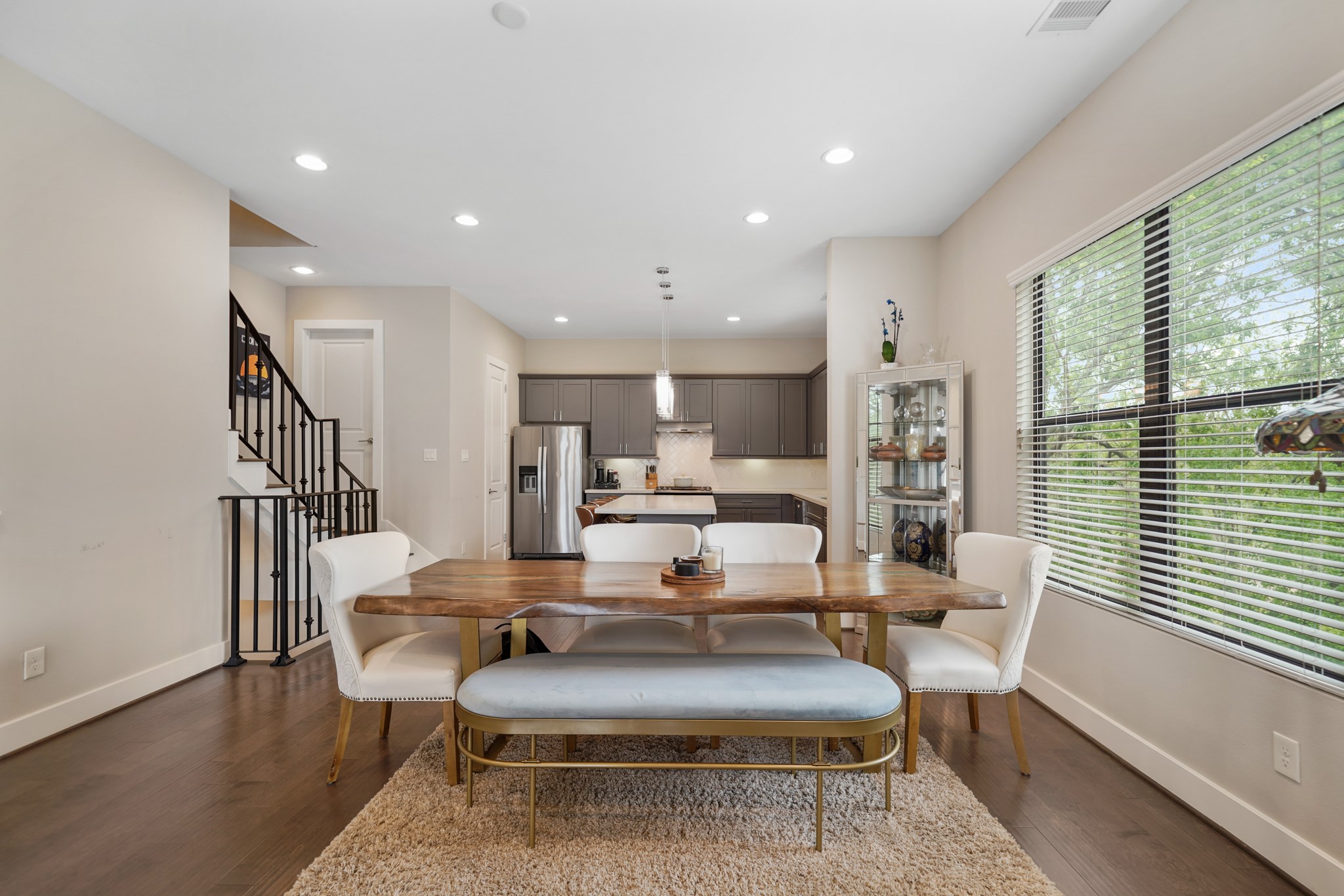 Large windows with blinds overlook the side of the home. Need a dining room table? The Landlord is willing to leave this
table.