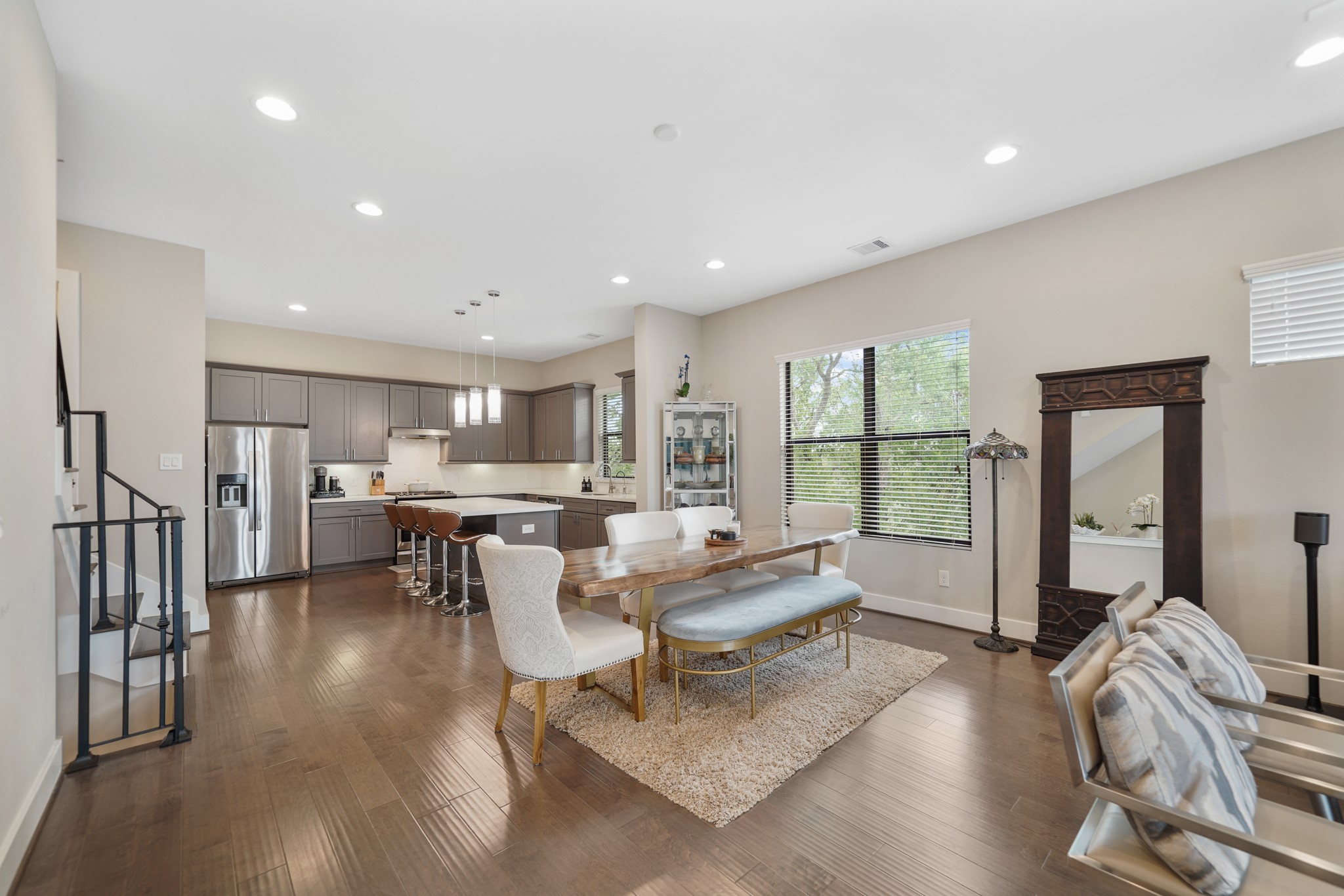 The dining room sits just between the living room & kitchen with a high ceiling, recessed lighting, pre-wiring for a light fixture & hardwood floors.