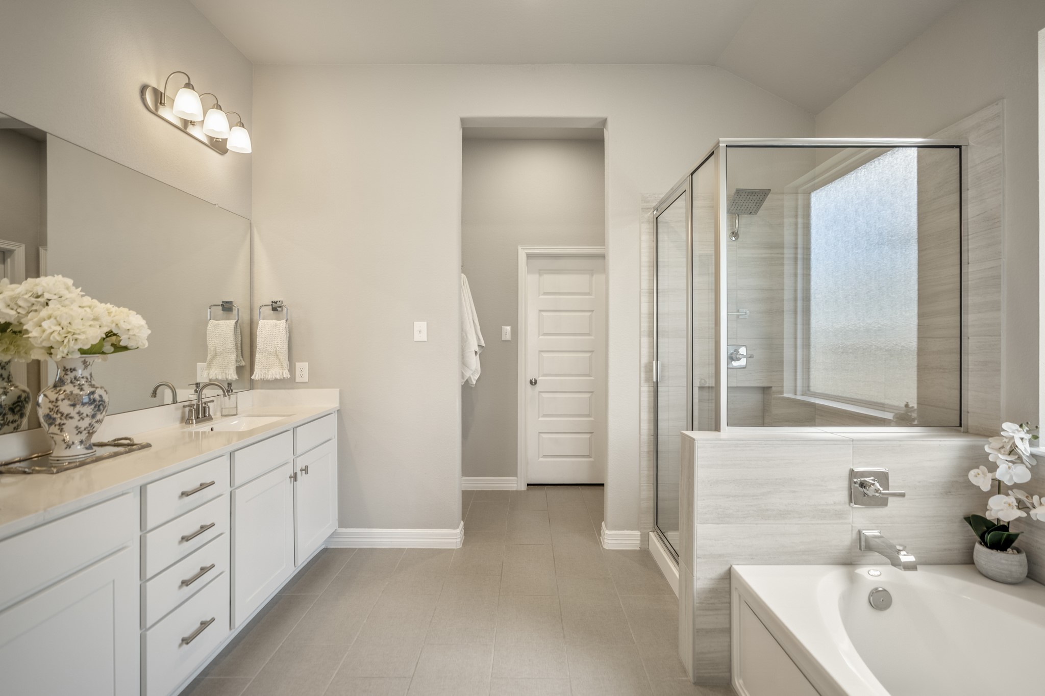 Primary bathroom features separate shower and soaking tub, walk-in closet and water closet.