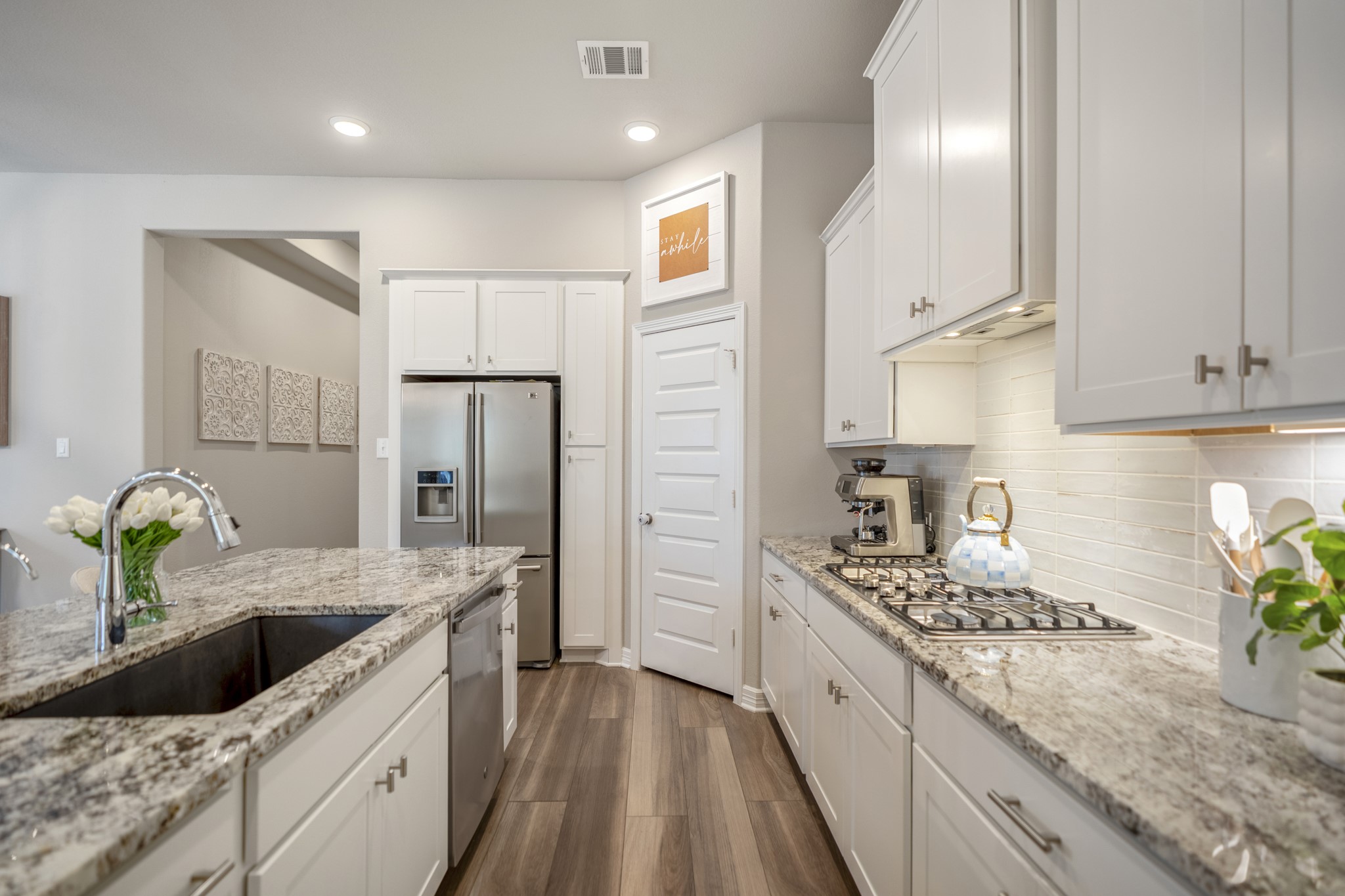 Notice the gas cooktop and Blanco undermount kitchen sink!