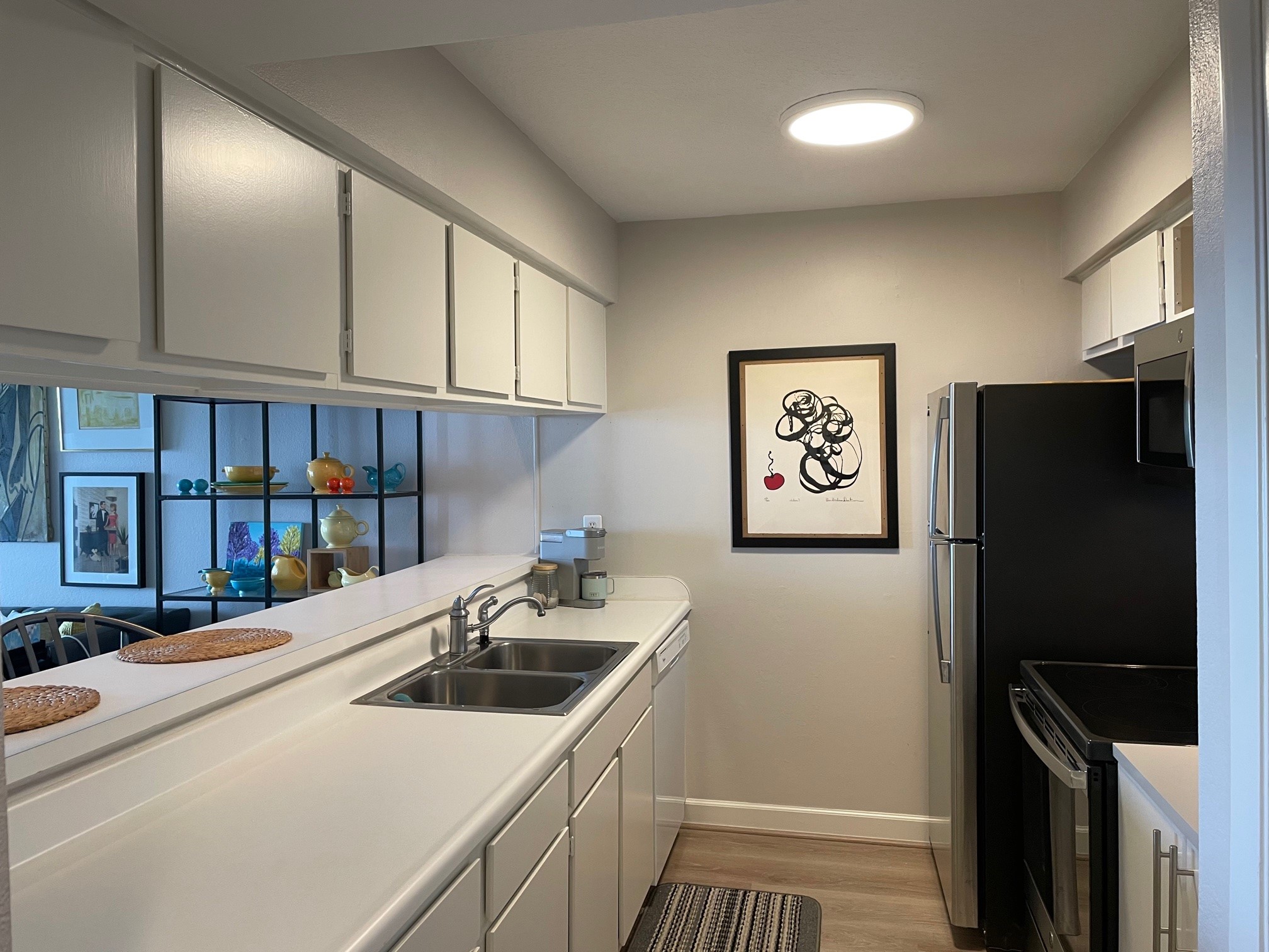 Look at all the counter space and storage, PLUS a pantry for extra storage.