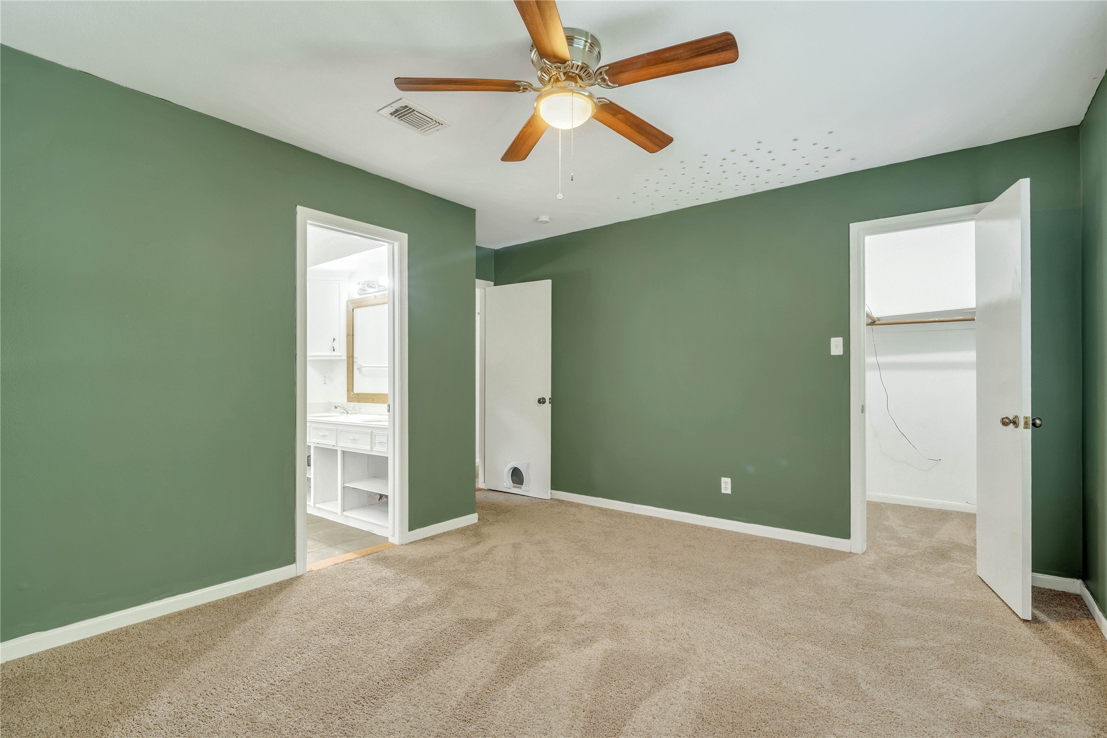Another view highlighting the bedrooms generous proportions and convenient connection to the shared Jack-and-Jill bathroom.