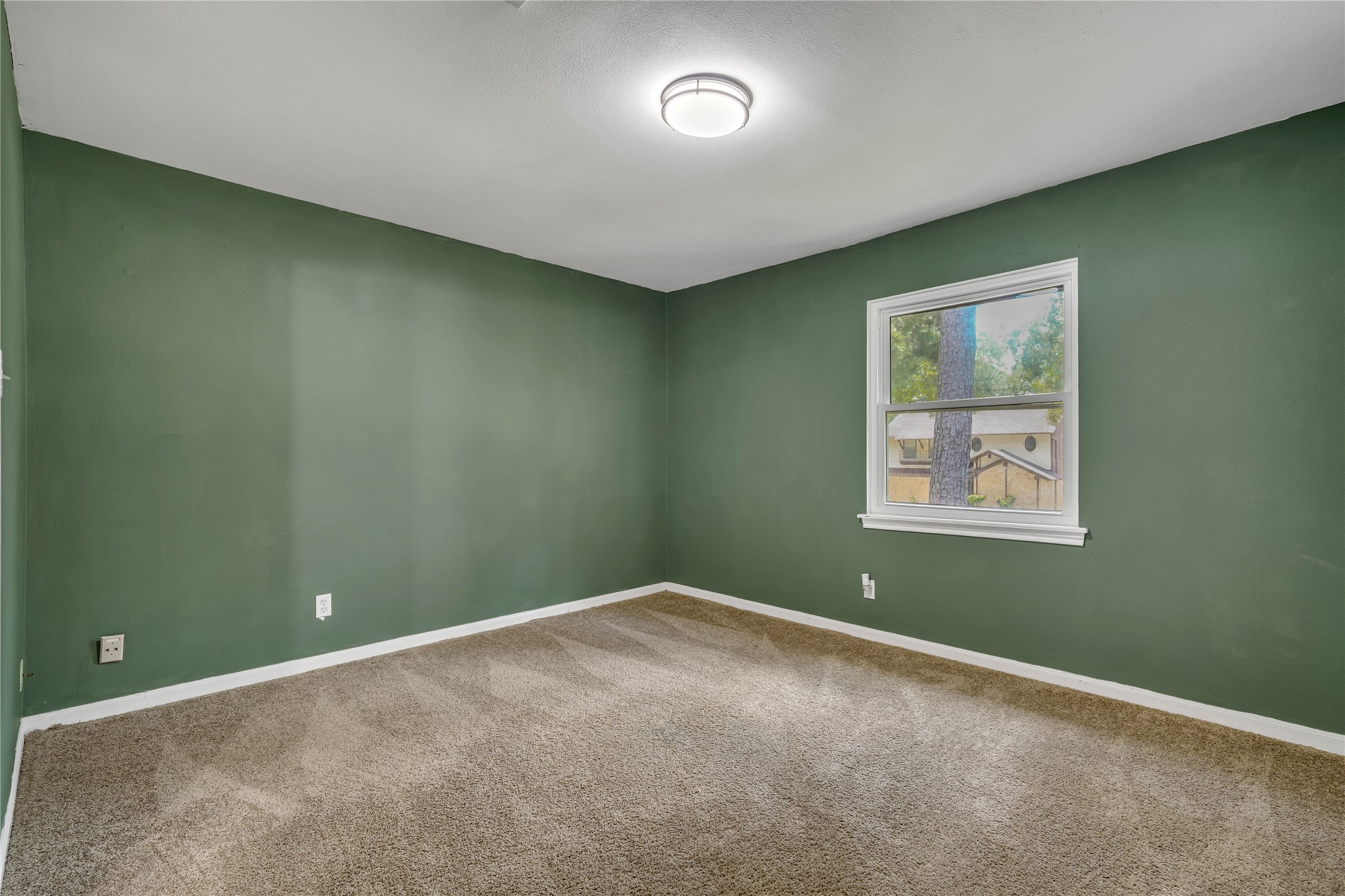 Spacious upstairs bedroom offering excellent proportions, natural light, and direct access to the shared Jack-and-Jill bathroom.