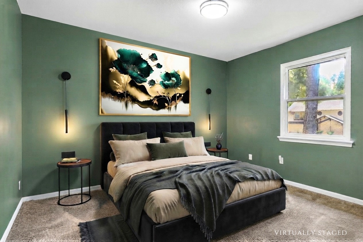 Virtually staged to showcase the scale of this upstairs bedroom, comfortably accommodating substantial furnishings with convenient access to the Jack-and-Jill bathroom.
