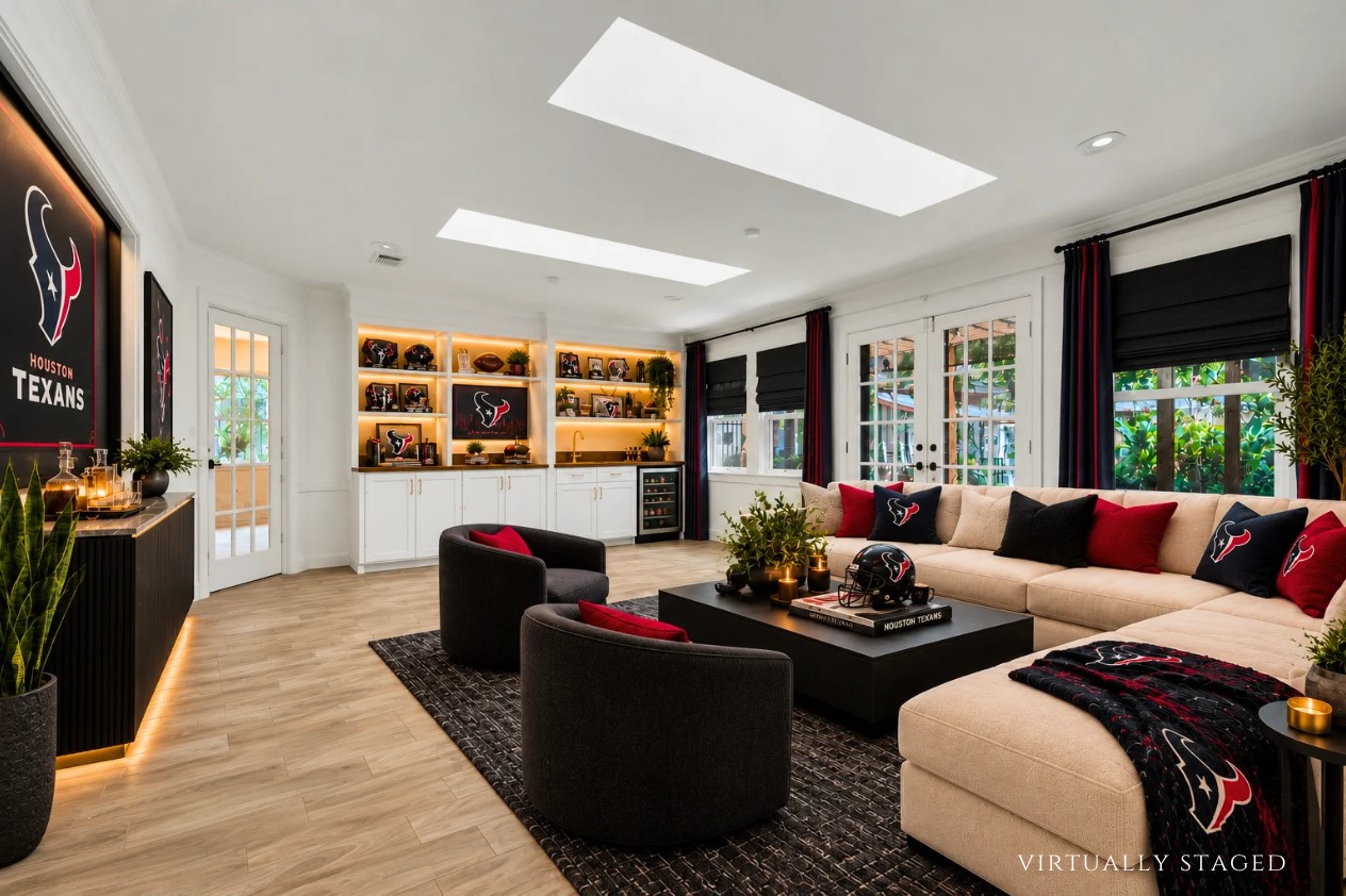Virtually staged to showcase the sunrooms potential as a sophisticated entertainment lounge, featuring Houston Texans-inspired dcor, luxurious seating, and an inviting game-day atmosphere.