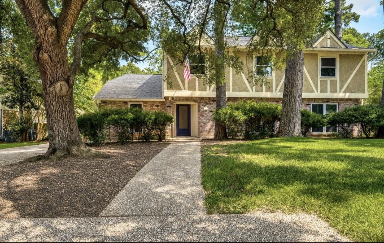 Closer perspective highlighting the homes welcoming approach, mature landscaping, and tree-lined front yard. Closer perspective highlighting the homes welcoming approach, mature landscaping, and tree-lined front yard.
