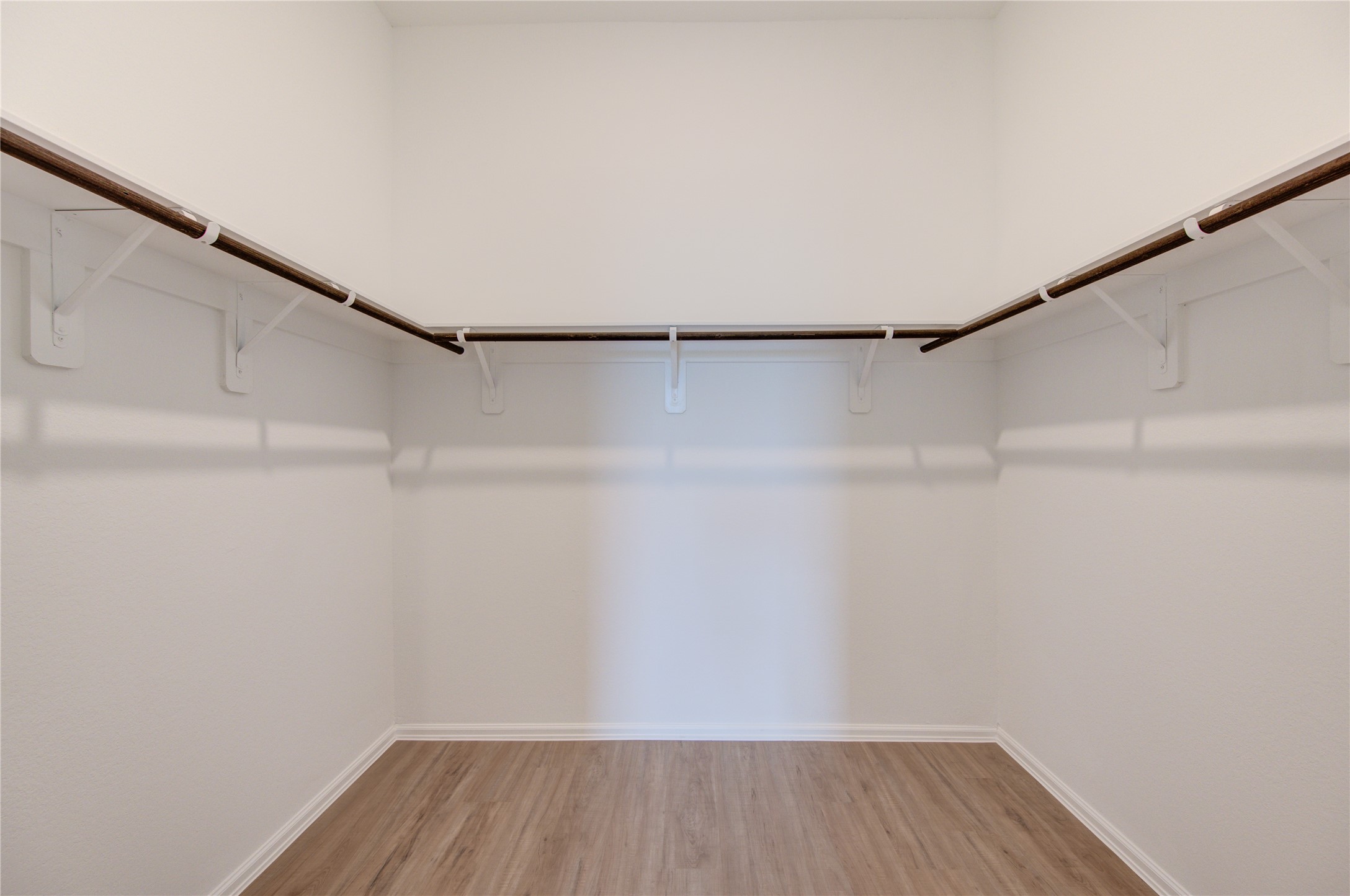 Walk in closet in the primary bedroom