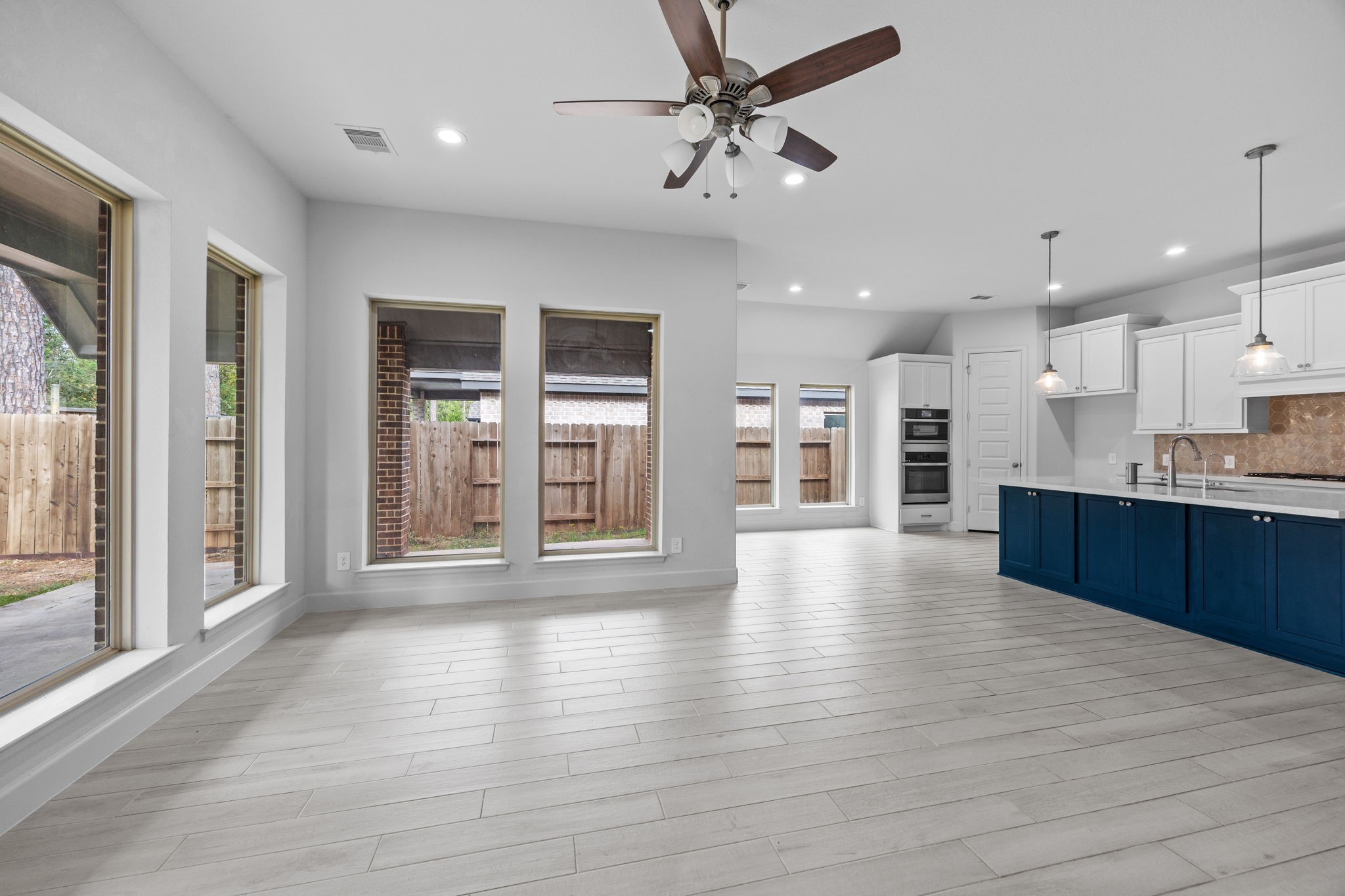 Seamless flow between the kitchen, dining, and living spaces creates an inviting atmosphere.
