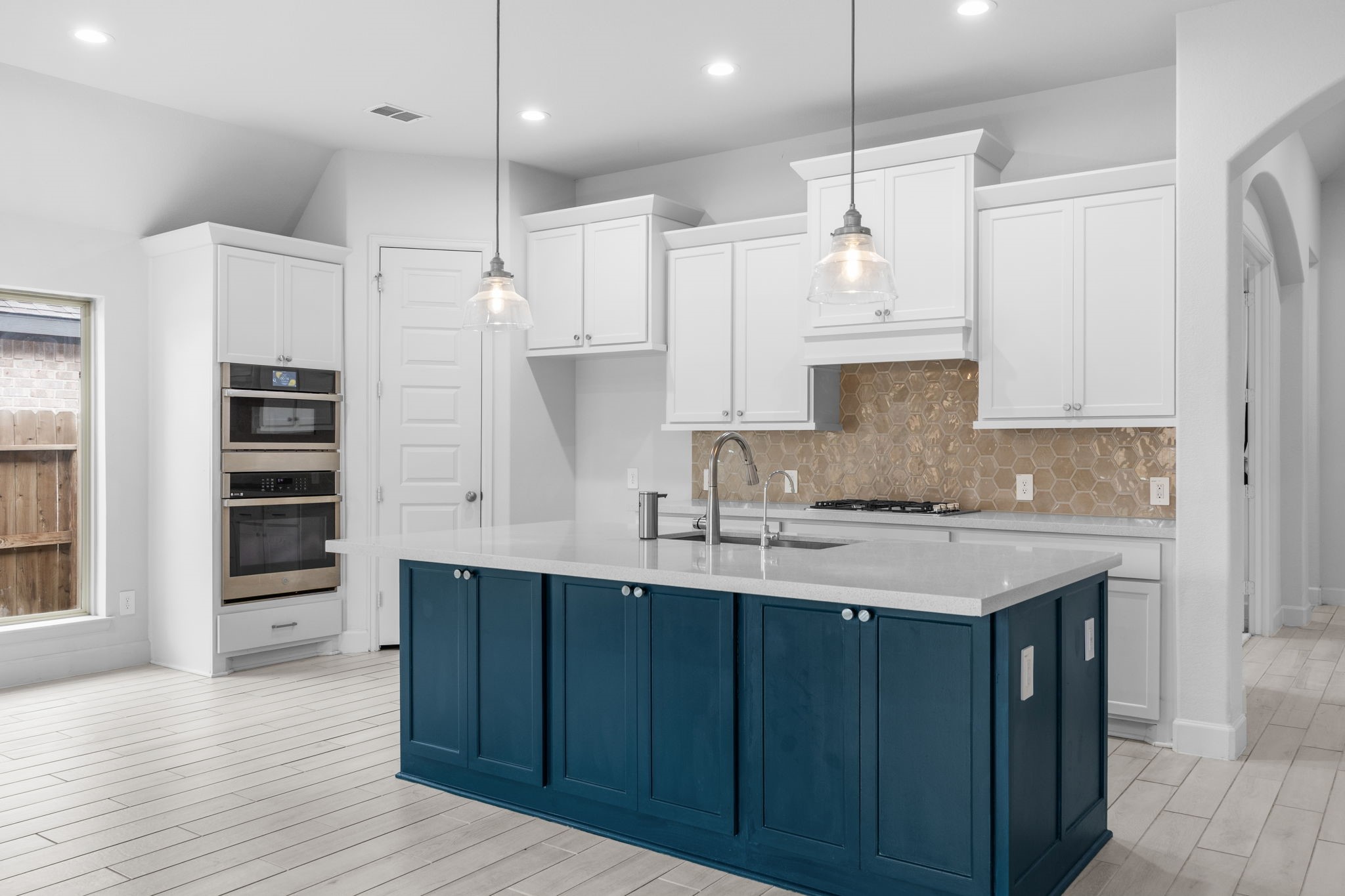 Beautifully appointed kitchen with elegant finishes, built-in appliances, and ample storage.