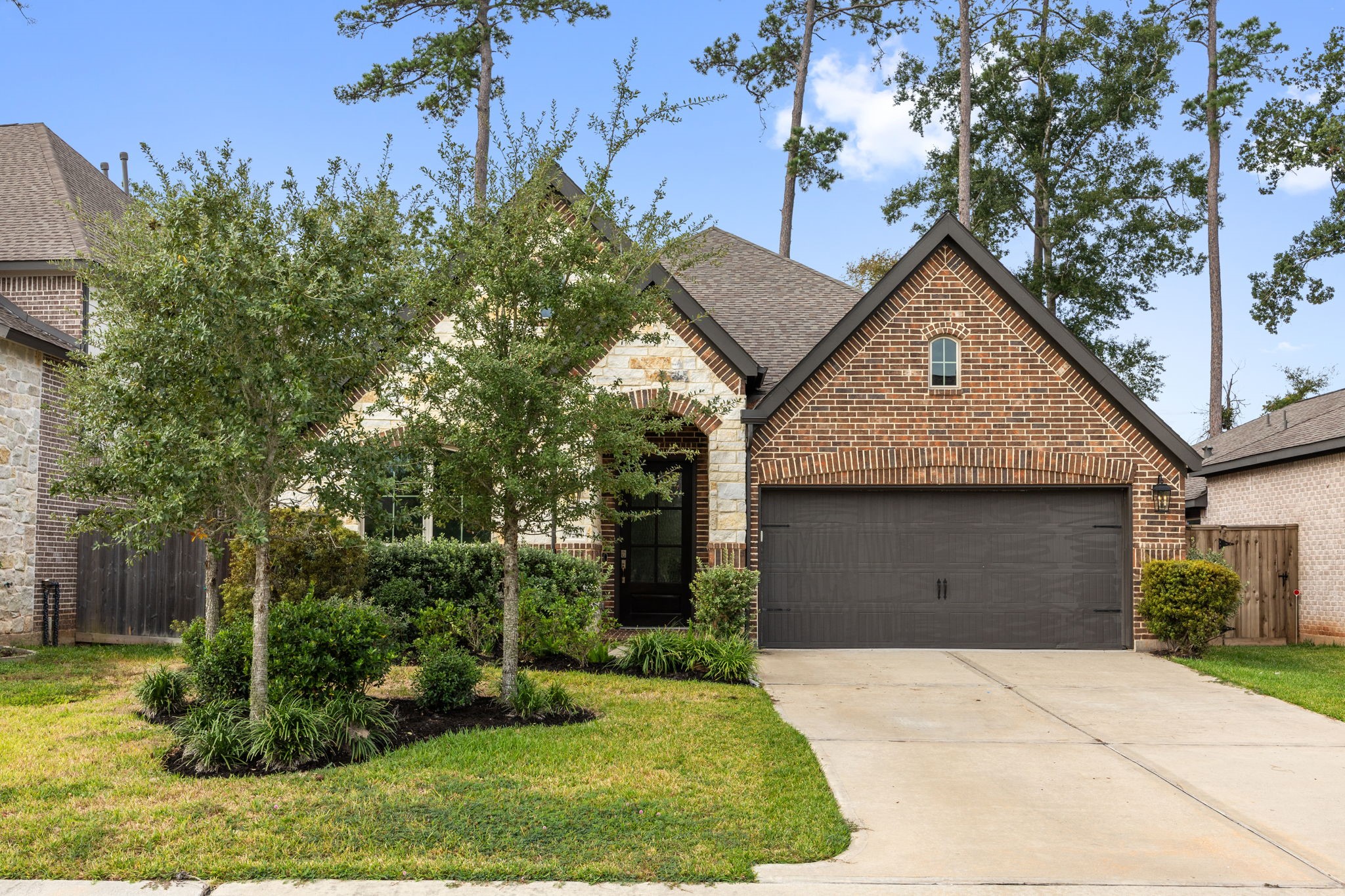 Beautiful brick elevation, manicured landscaping, and inviting curb appeal welcome you home.