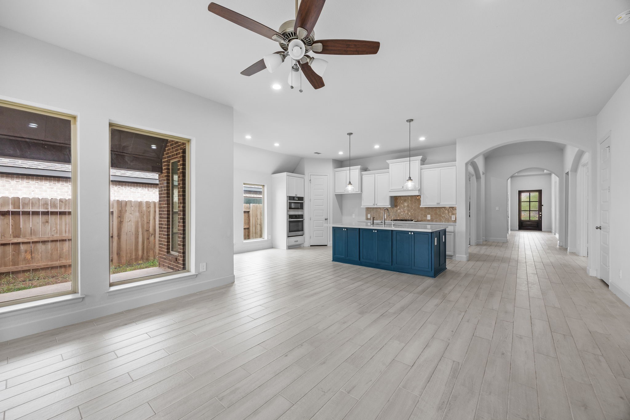 Expansive open-concept living area with abundant natural light and effortless access to the kitchen.