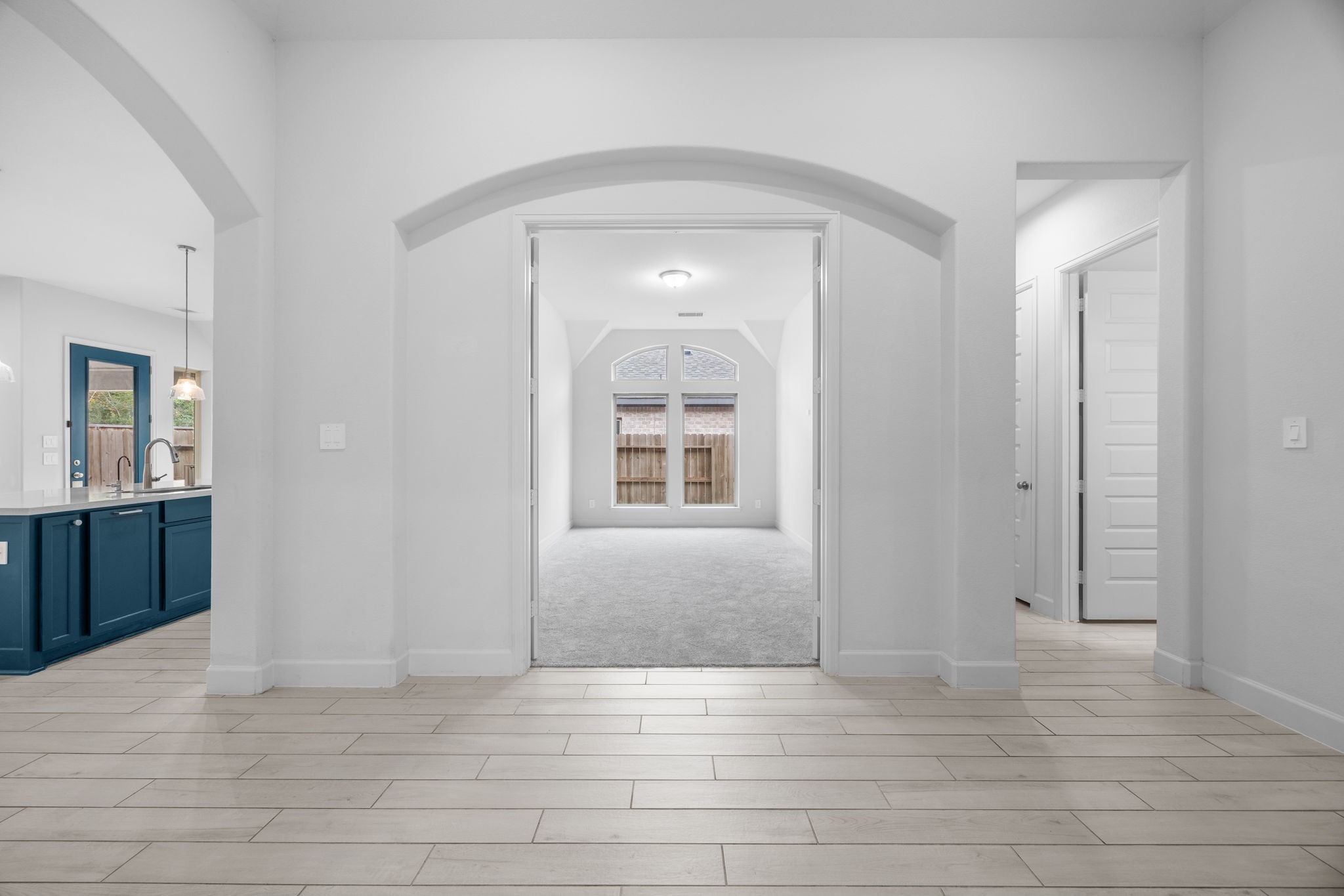 Elegant architectural archways define the home's open and thoughtfully designed layout.