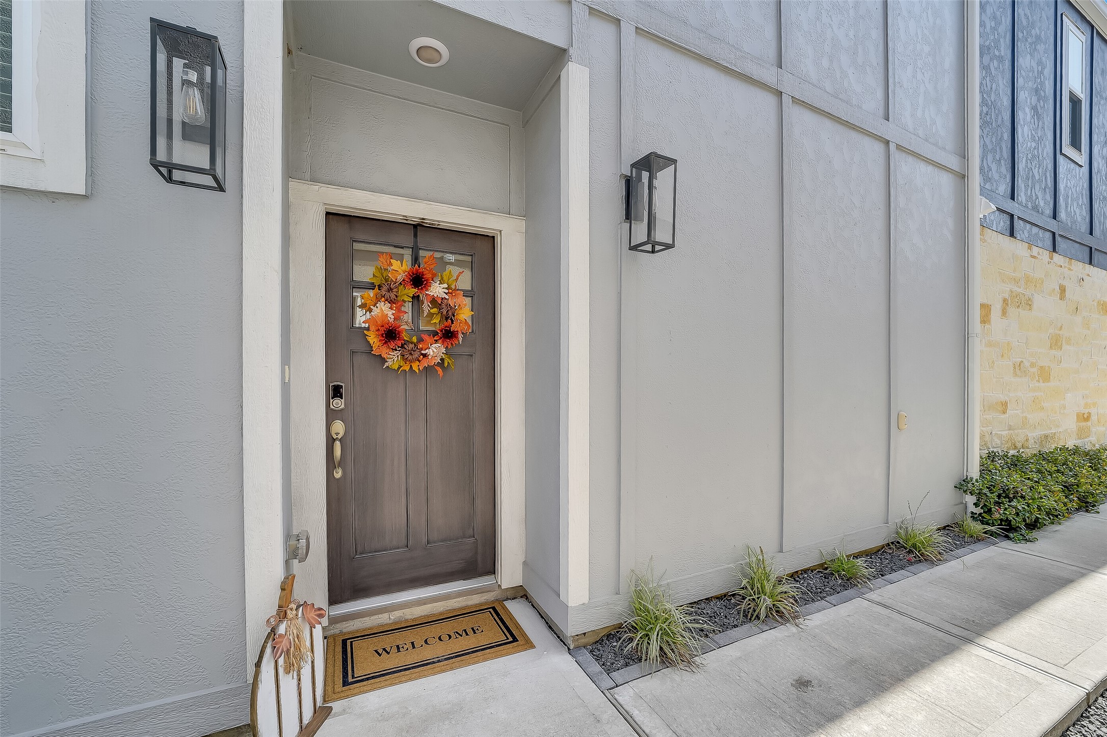 A sheltered front entry offers a welcoming spot to greet guests, with a windowed front door that brings light inside. A sheltered front entry offers a welcoming spot to greet guests, with a windowed front door that brings light inside.